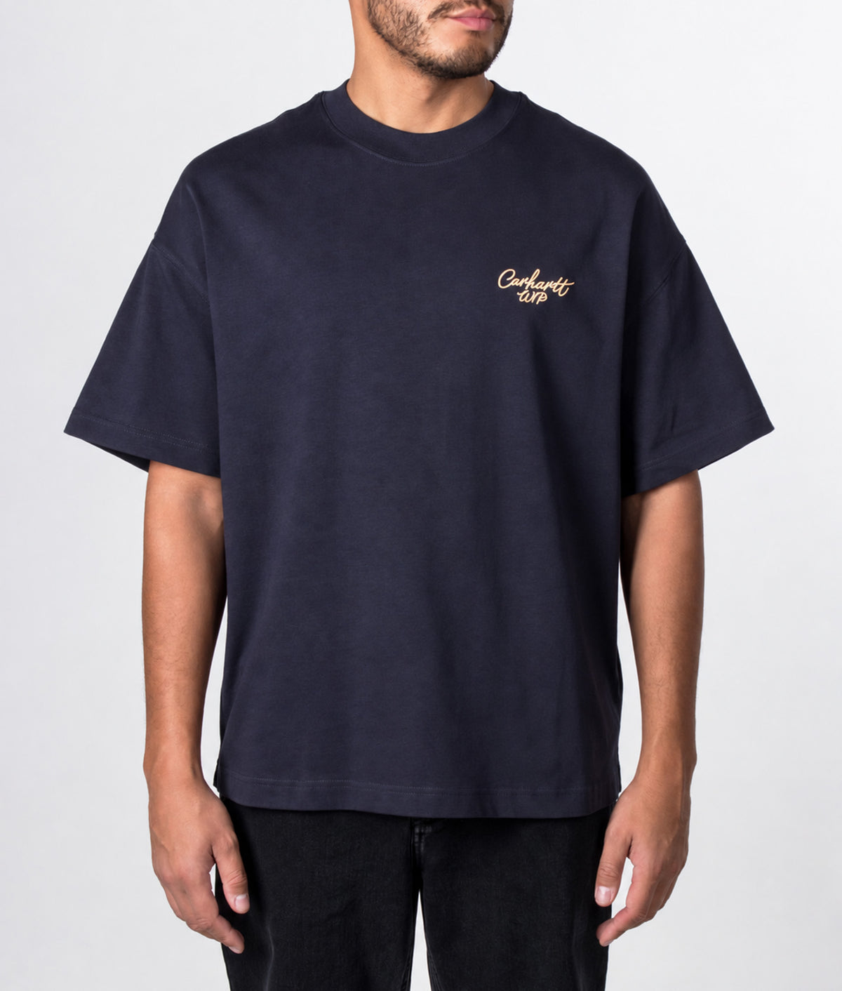 Carhartt WIP Boxy Loose Fit Signature Script T-Shirt in Dark Navy and WIP Dusty H at EQVVS Menswear. Model front shot.