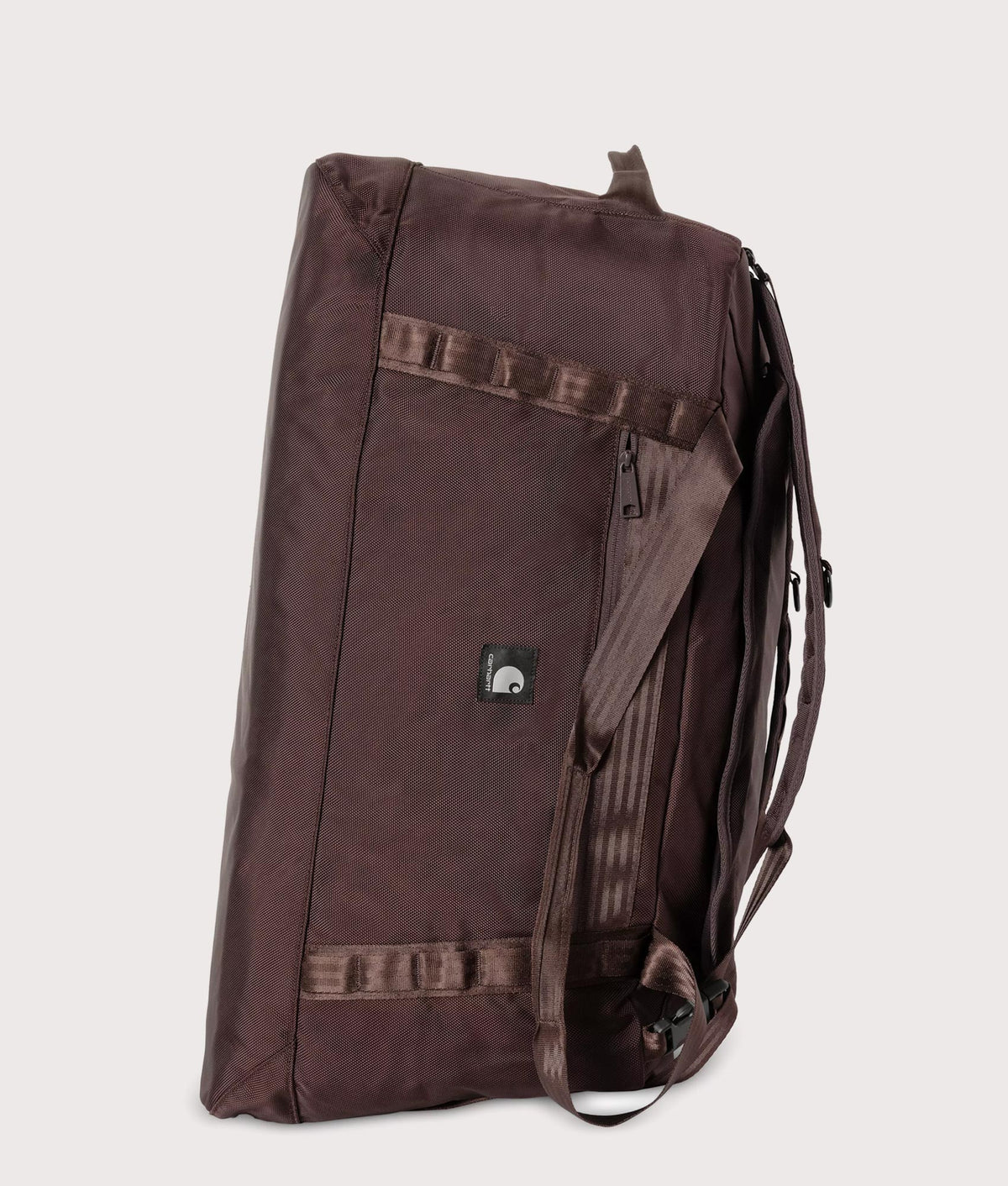 Carhartt WIP Richmond Large Duffle Bag in Palisander at EQVVS Menswear. Side shot.