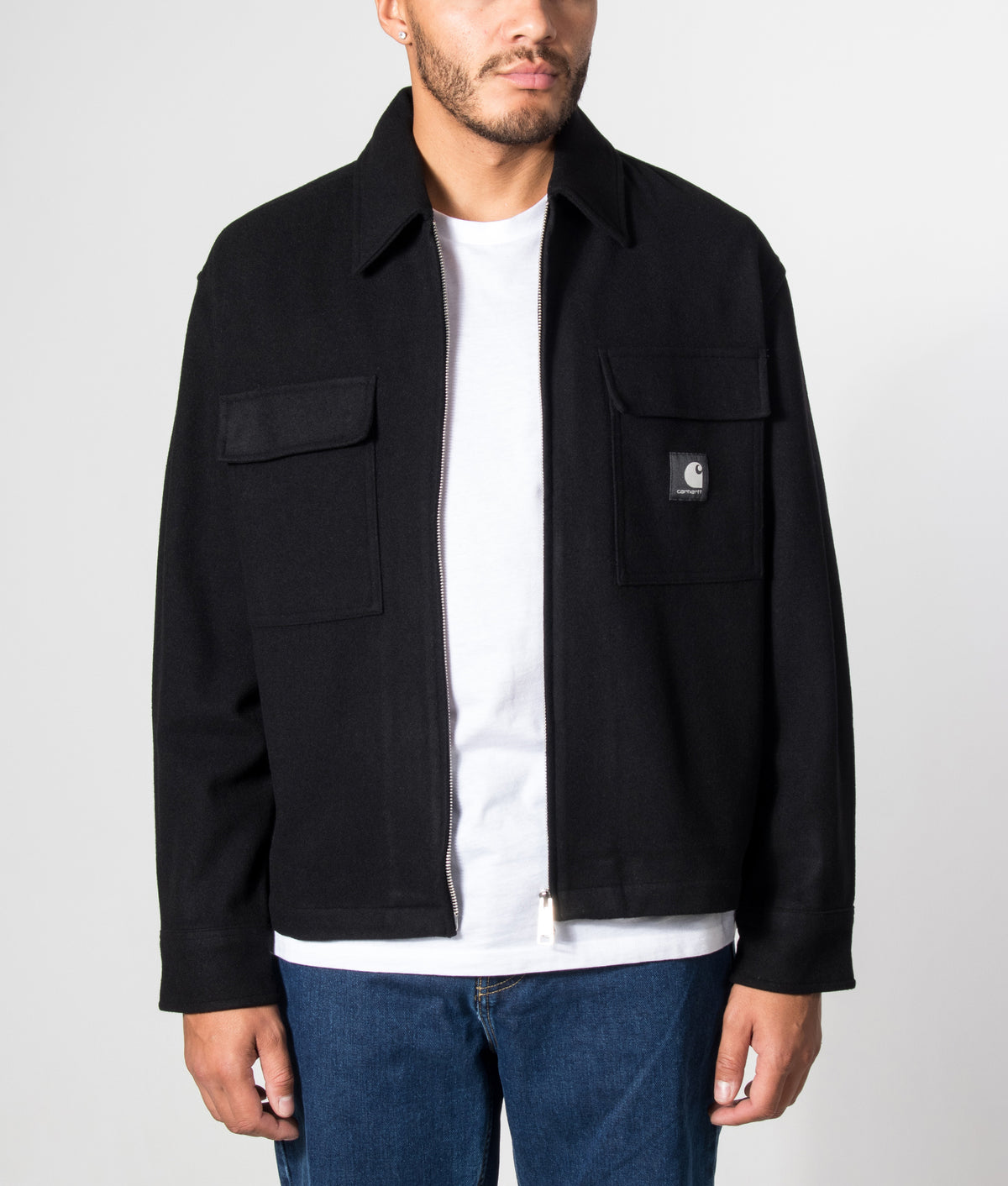 Carhartt WIP Regular Fit Atoka Shirt Jacket in Black at EQVVS Menswear.  Model front shot.