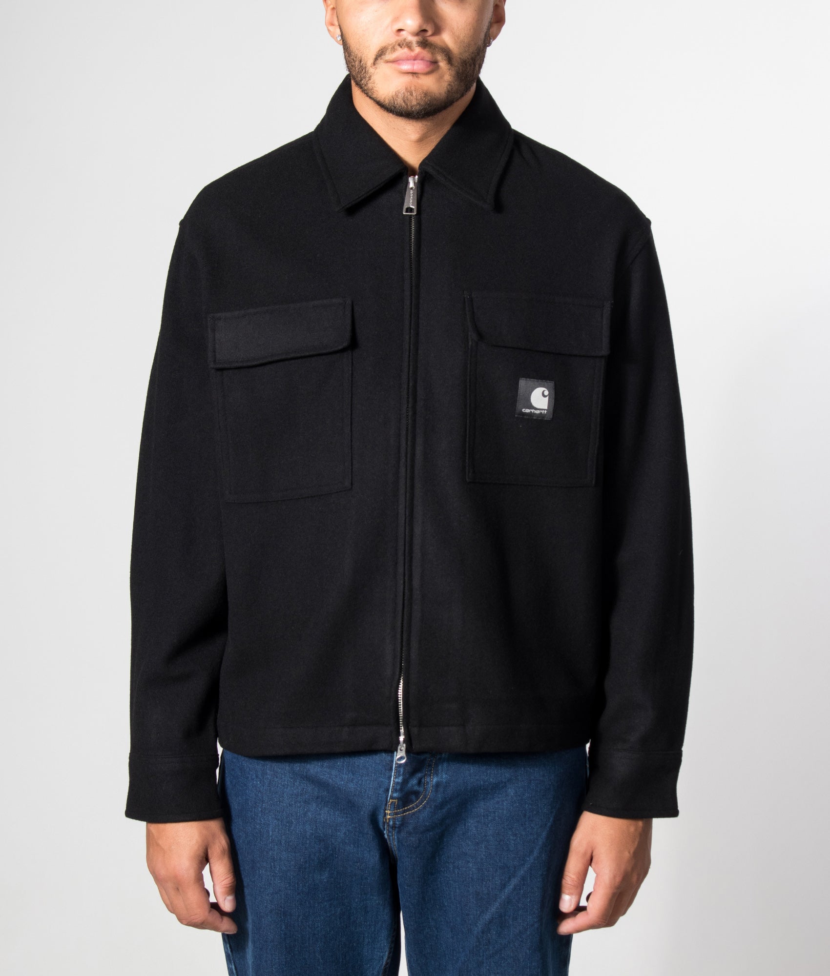Carhartt WIP Regular Fit Atoka Shirt Jacket in Black at EQVVS Menswear. Model front shot.