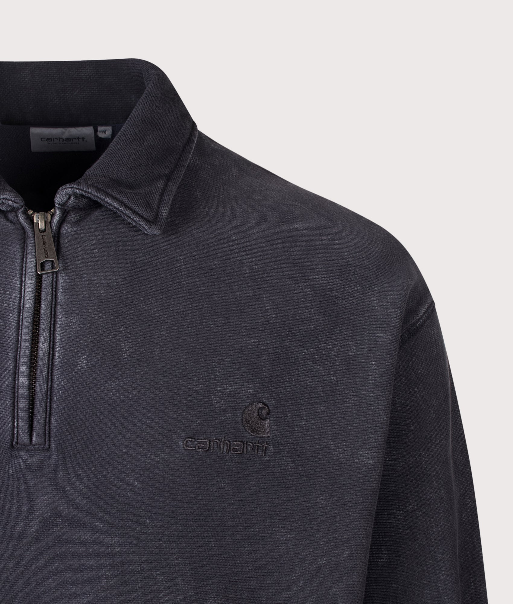 Carhartt WIP Boxy Loose Fit Lambert Polo Neck Sweatshirt in Black Moon Wash at EQVVS Menswear. Detail shot.