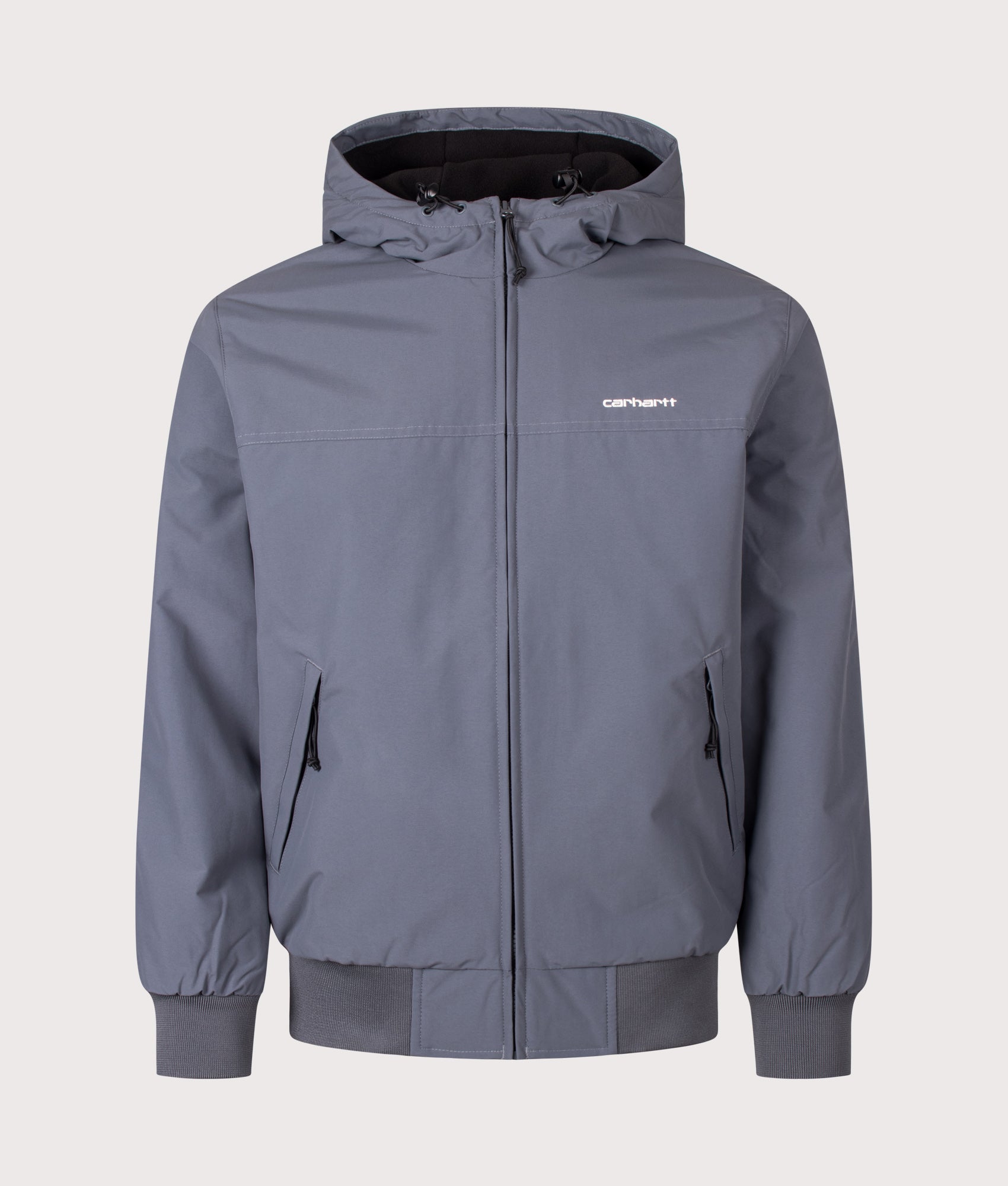 Carhartt WIP Regular Fit Hooded Sail Jacket in Styx and White at EQVVS Menswear. Front shot.