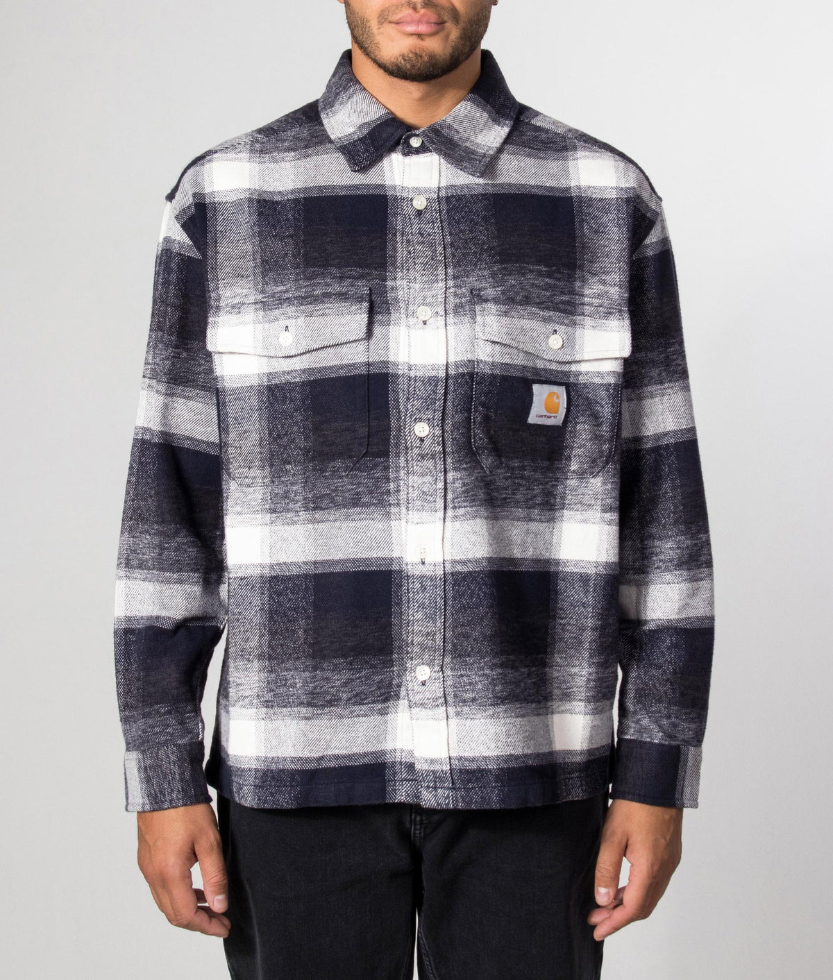 Carhartt WIP Regular Fit Esterson Shirt in  Esterson Check and Dark Navy at EQVVS Menswear. Model front shot.