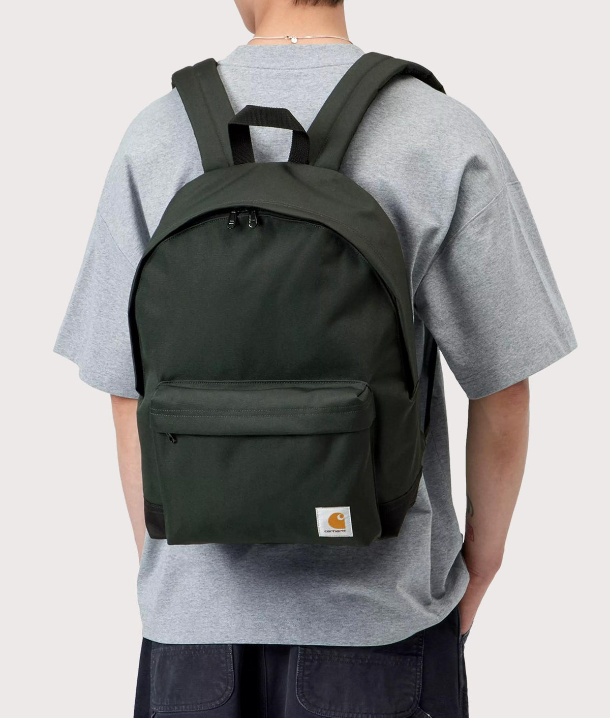Carhartt WIP Jake Backpack in Raven at EQVVS Menswear. Model shot.