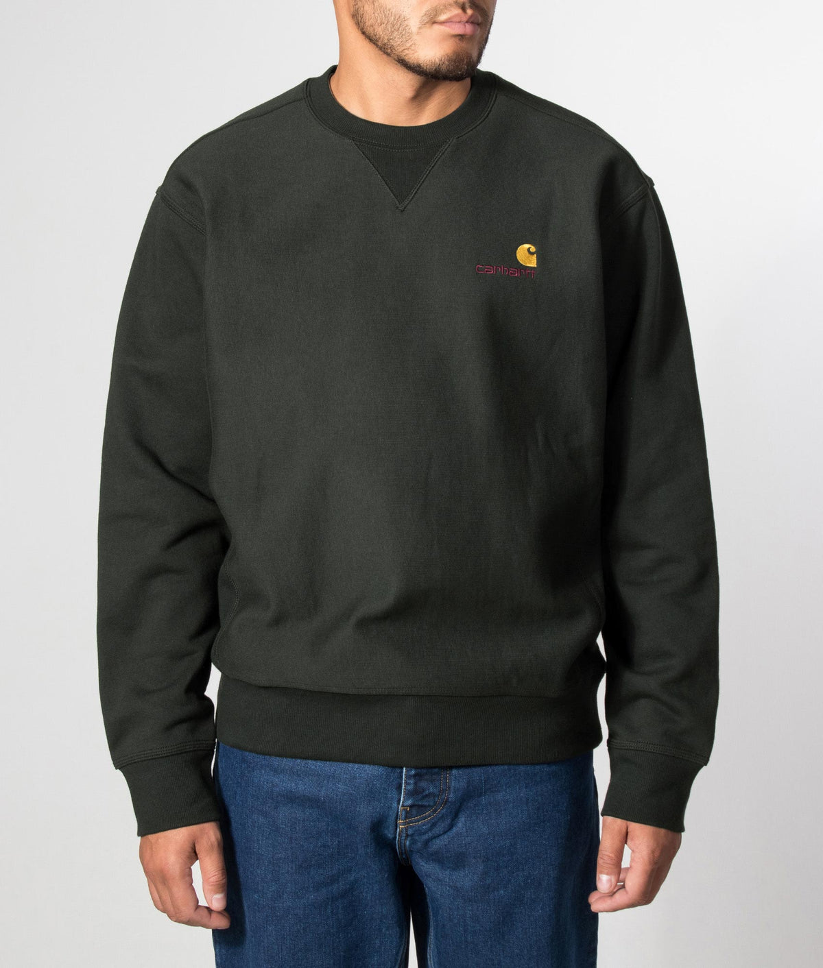 Carhartt WIP Loose Fit American Script Sweatshirt in Raven at EQVVS Menswear. Model front shot.