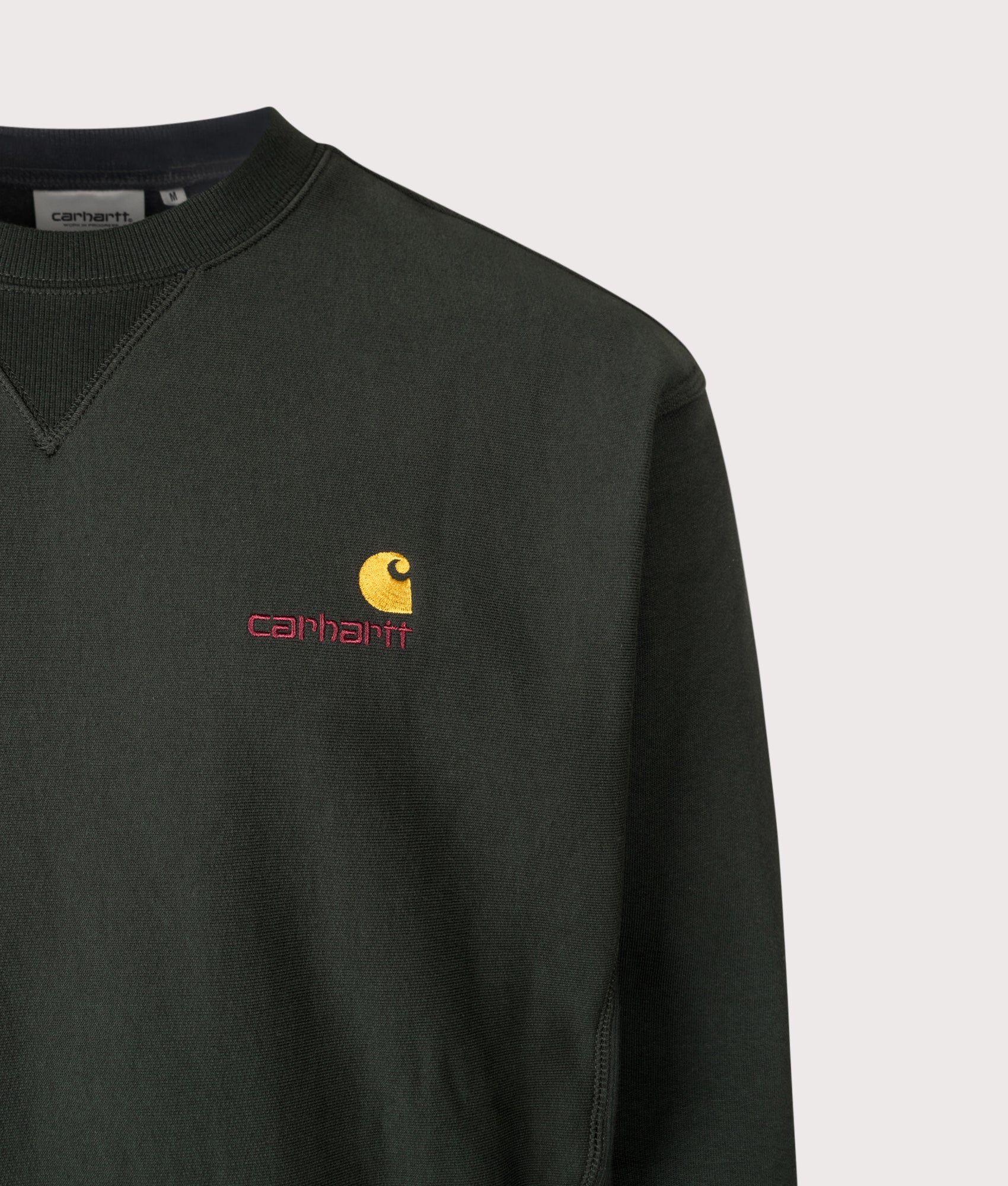 Carhartt WIP Loose Fit American Script Sweatshirt in Raven at EQVVS Menswear. Detail shot.