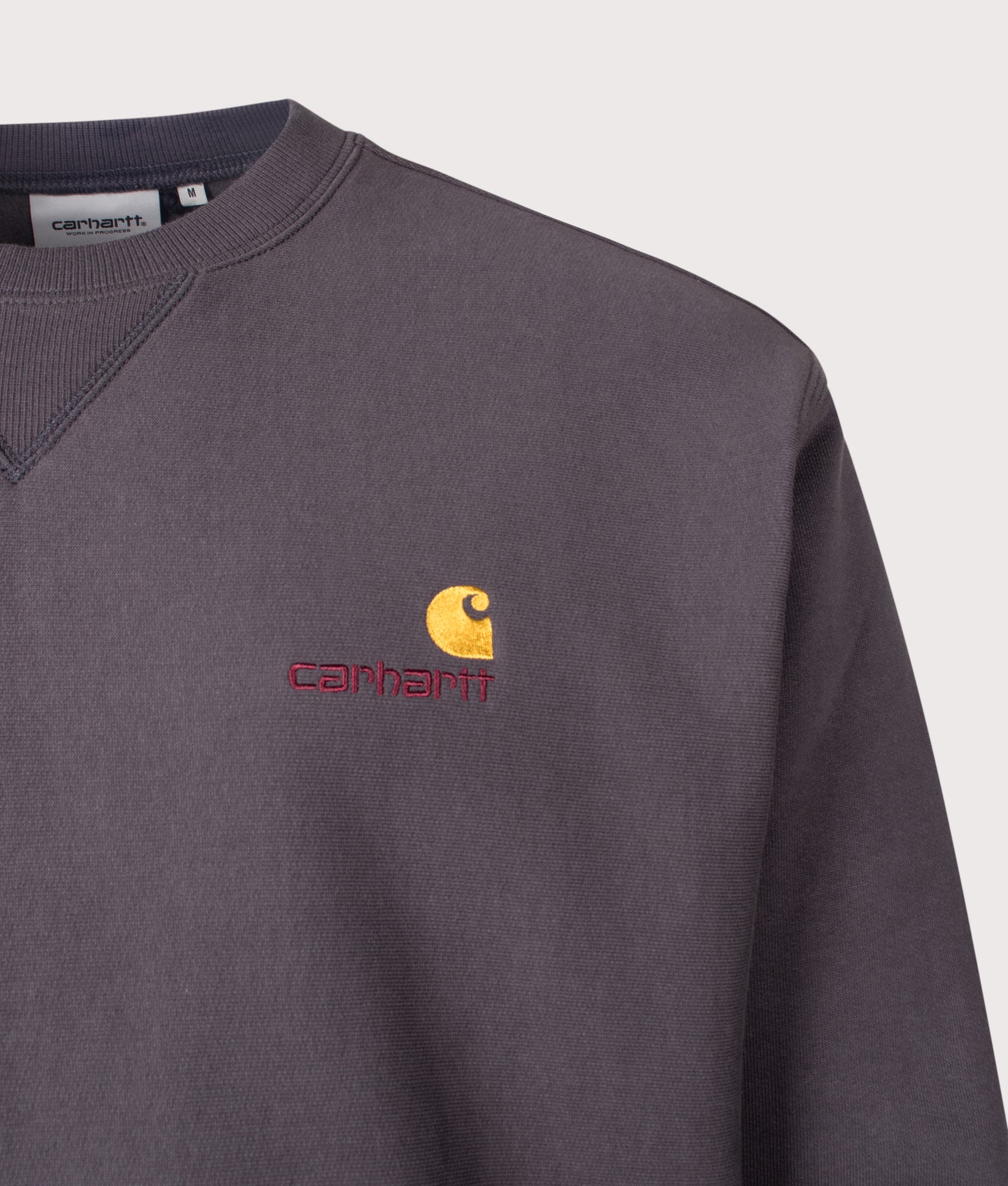 Carhartt WIP Loose Fit American Script Sweatshirt in Graphite at EQVVS Menswear. Detail shot.