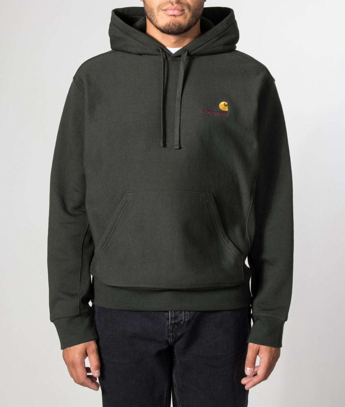 Carhartt WIP Loose Fit American Script Hoodie in Raven at EQVVS Menswear. Model front shot.