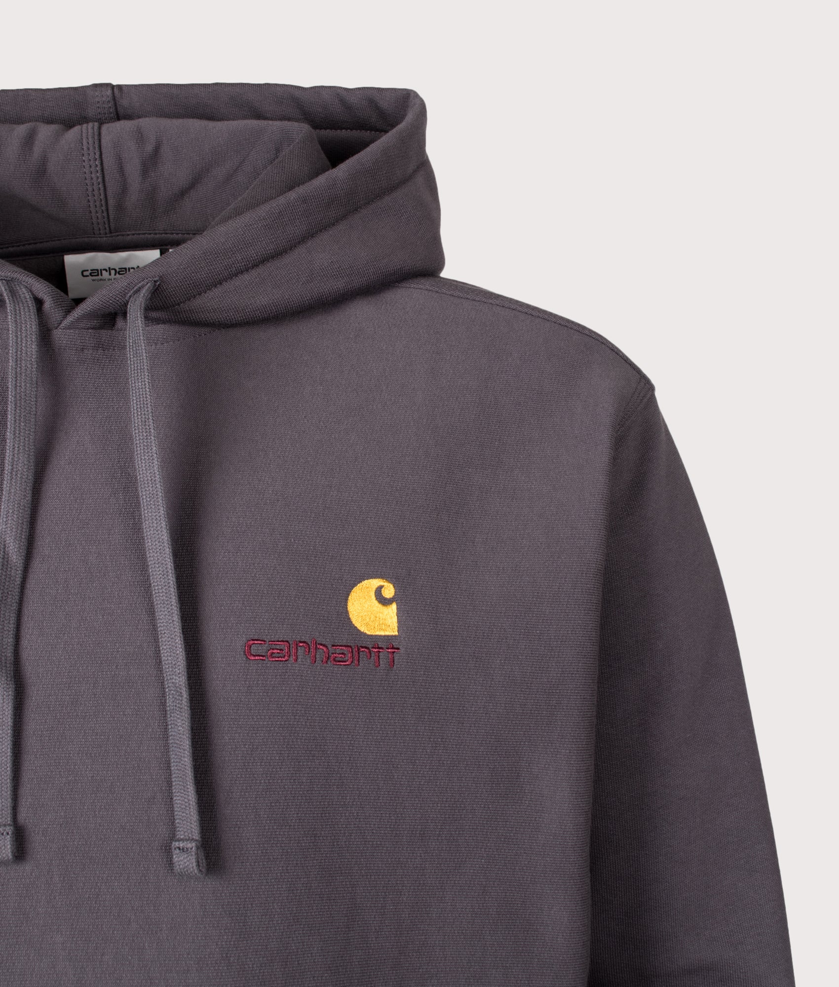 Carhartt WIP Loose Fit American Script Hoodie in Graphite at EQVVS Menswear. Detail shot.