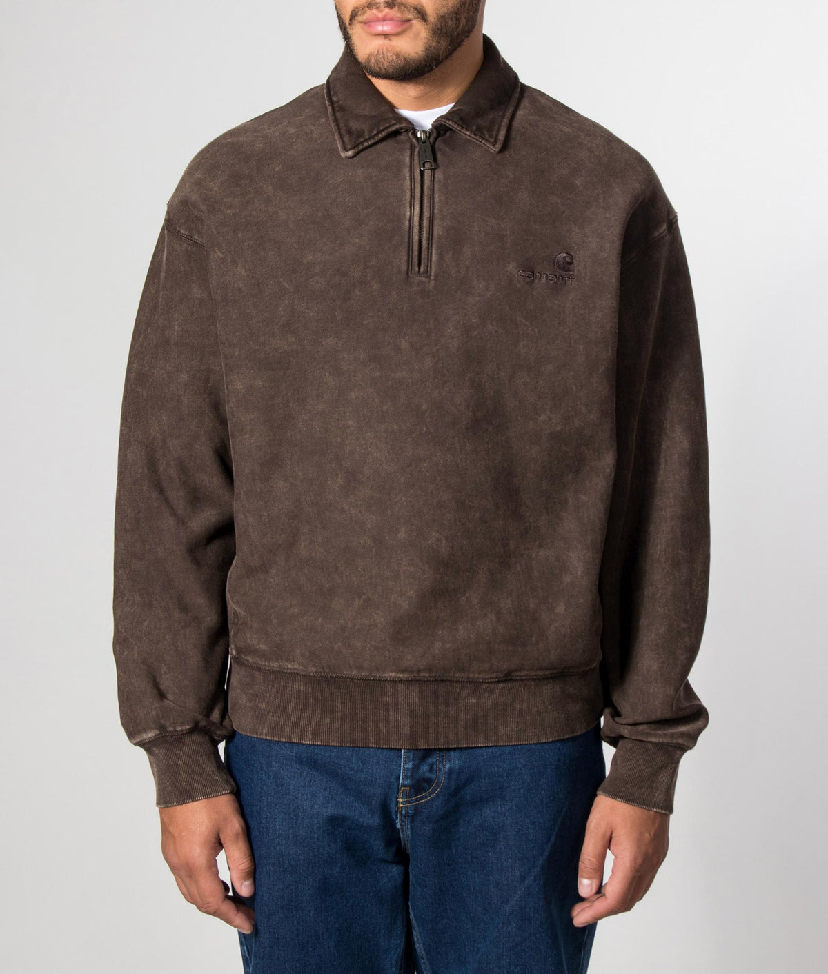 Carhartt WIP Boxy Loose Fit Lambert Polo Neck Sweatshirt in Tobacco Moon Wash at EQVVS Menswear. Model front shot.