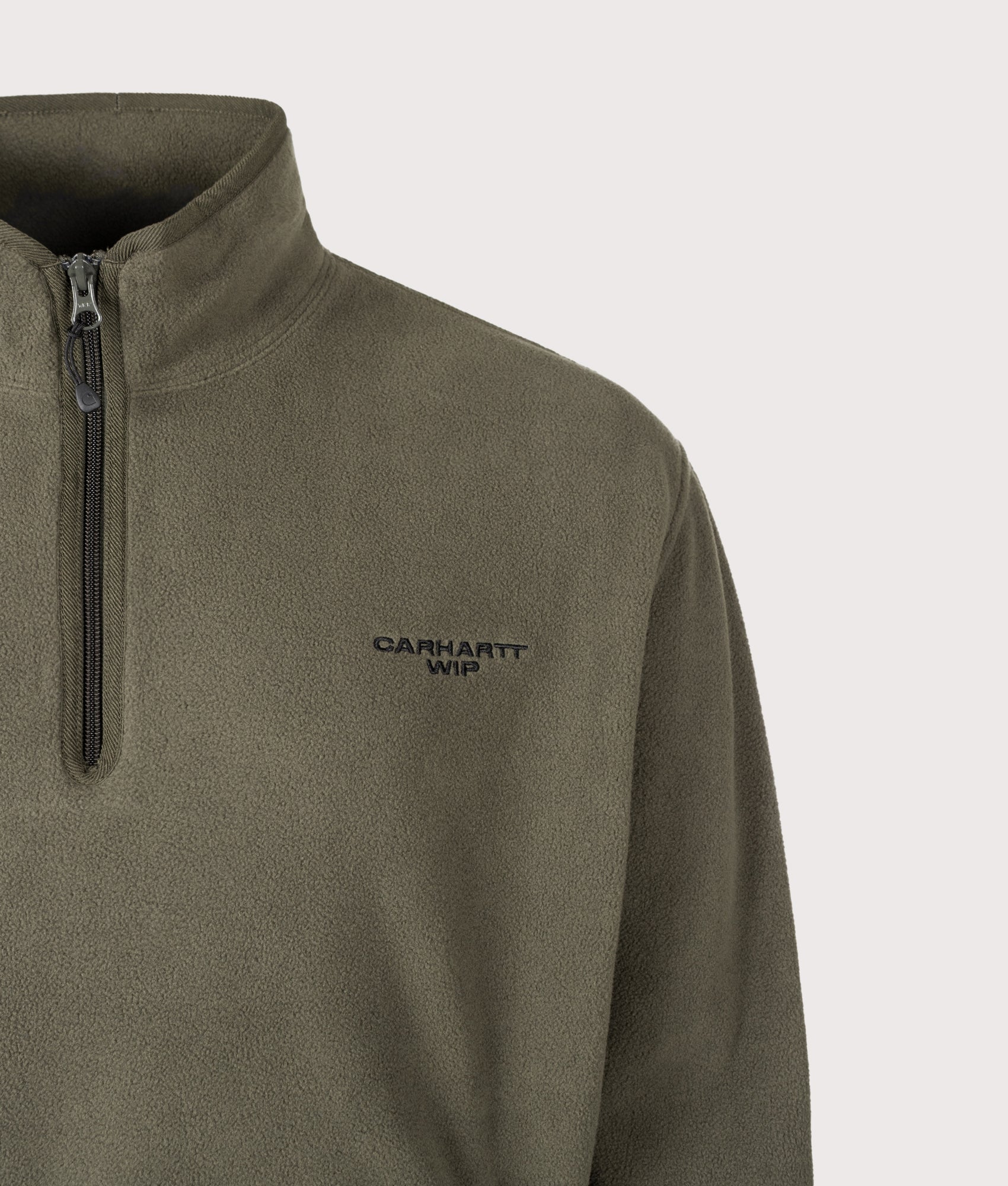 Carhartt WIP Balloon Fit Edmore Quarter Zip Fleece Sweatshirt in Cypress and Black at EQVVS Menswear. Detail shot.
