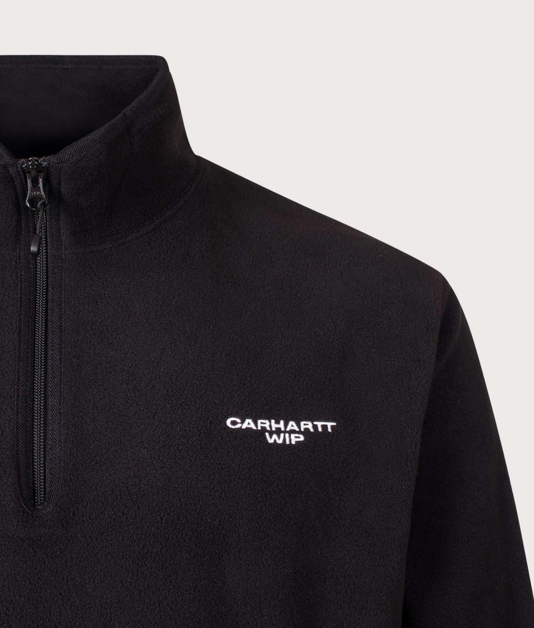 Carhartt WIP Balloon Fit Edmore Quarter Zip Fleece Sweatshirt in Black and White at EQVVS Menswear. Detail shot.
