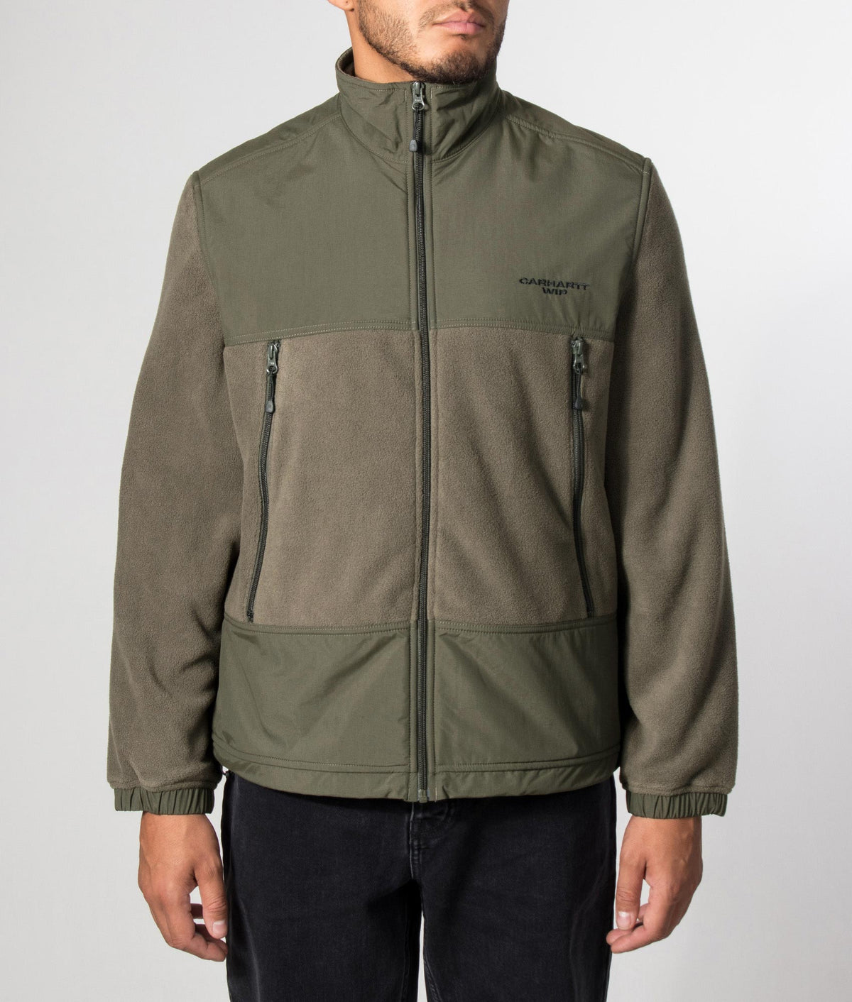 Carhartt WIP Balloon Fit Edmore Fleece Jacket in Cypress and Black at EQVVS Menswear. Model front shot.