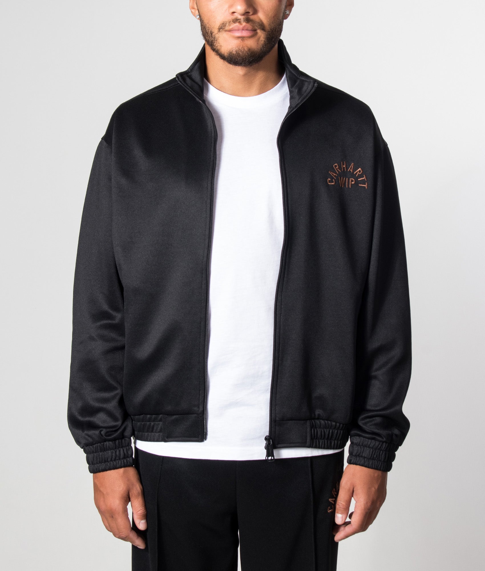 Carhartt WIP Loose Fit Bolon Jacket in Black at EQVVS Menswear. Model front shot.