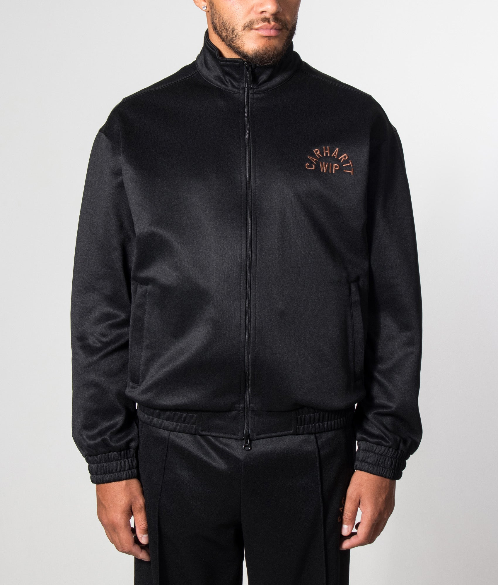 Carhartt WIP Loose Fit Bolon Jacket in Black at EQVVS Menswear. Model front shot.
