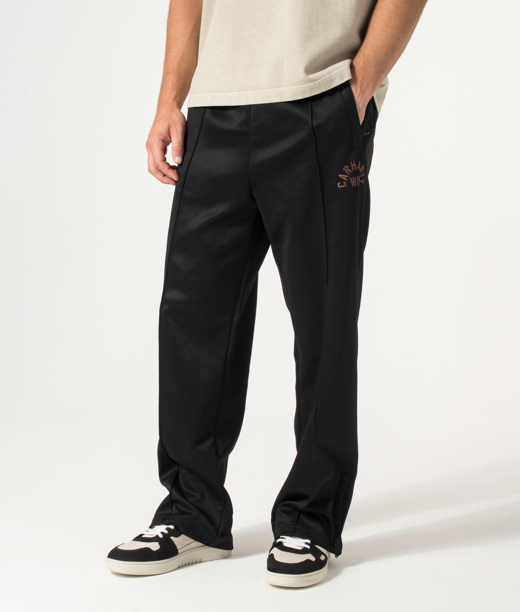 Carhartt WIP Loose Fit Bolon Sweat Pant in Black at EQVVS Menswear. Angled model front. 