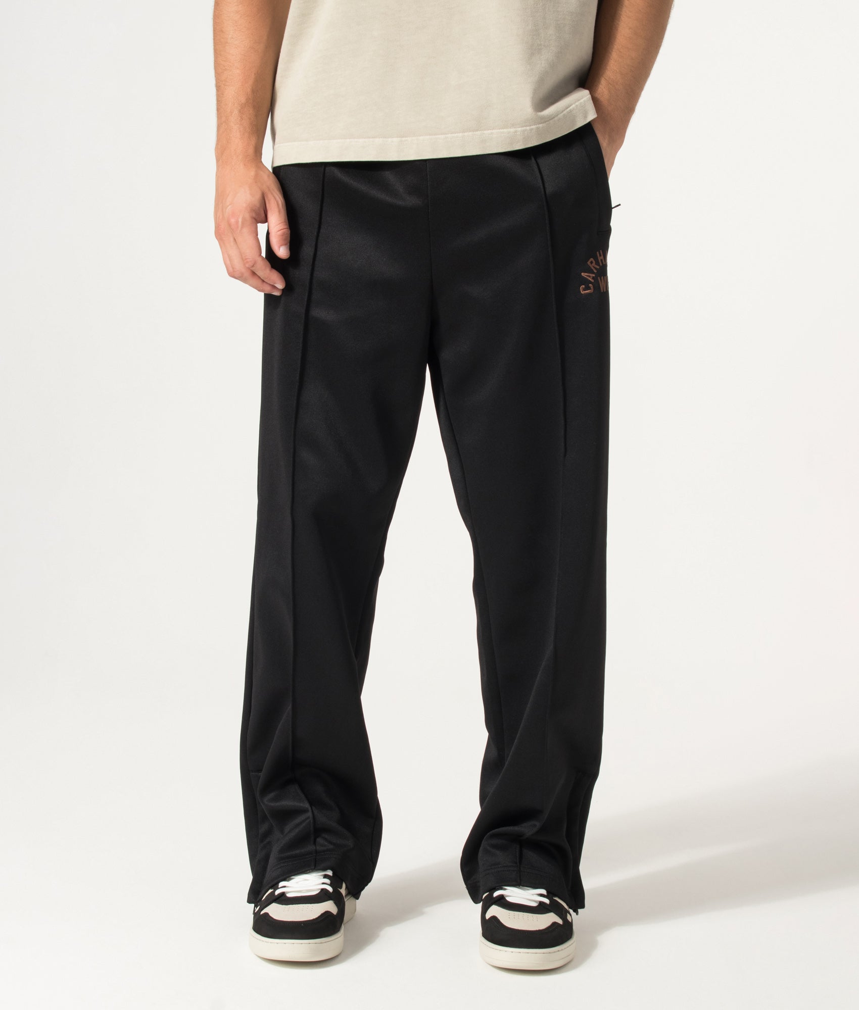 Carhartt WIP Loose Fit Bolon Sweat Pant in Black at EQVVS Menswear. Model front shot.