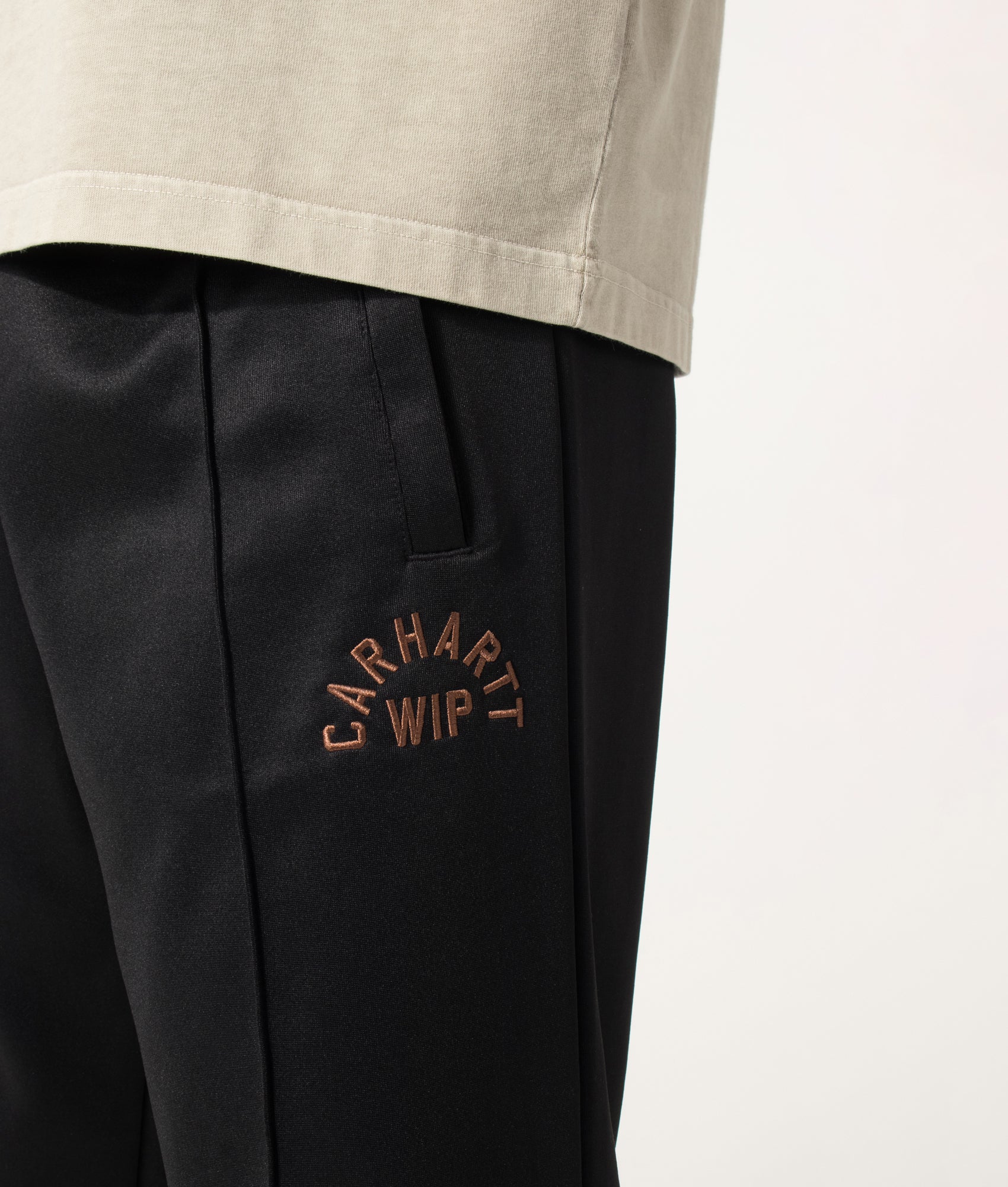 Carhartt WIP Loose Fit Bolon Sweat Pant in Black at EQVVS Menswear. Detail shot.