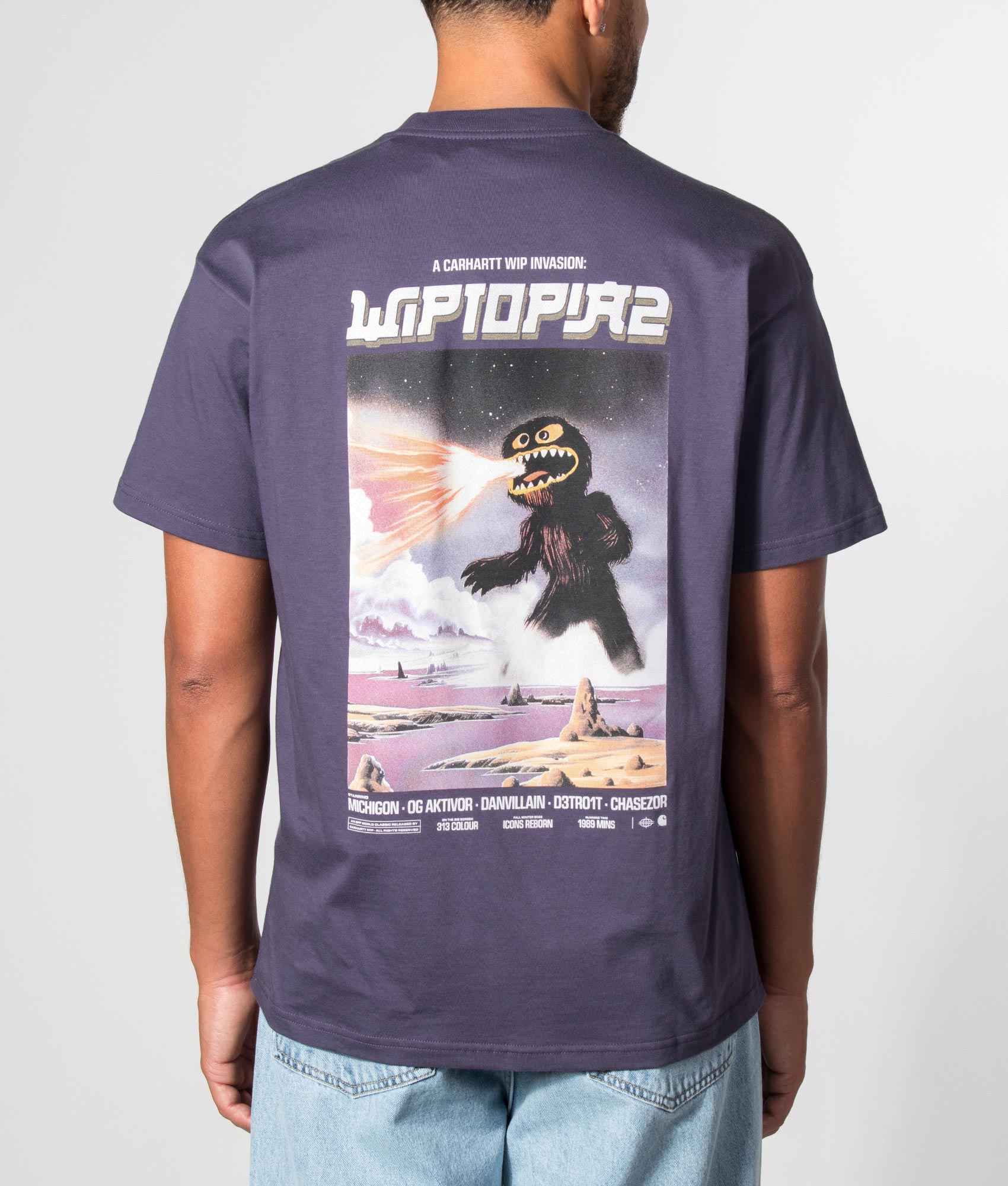 Carhartt WIP Loose Fit Wiptopia II T-Shirt in Shady Purple at EQVVS Menswear. Model back shot.