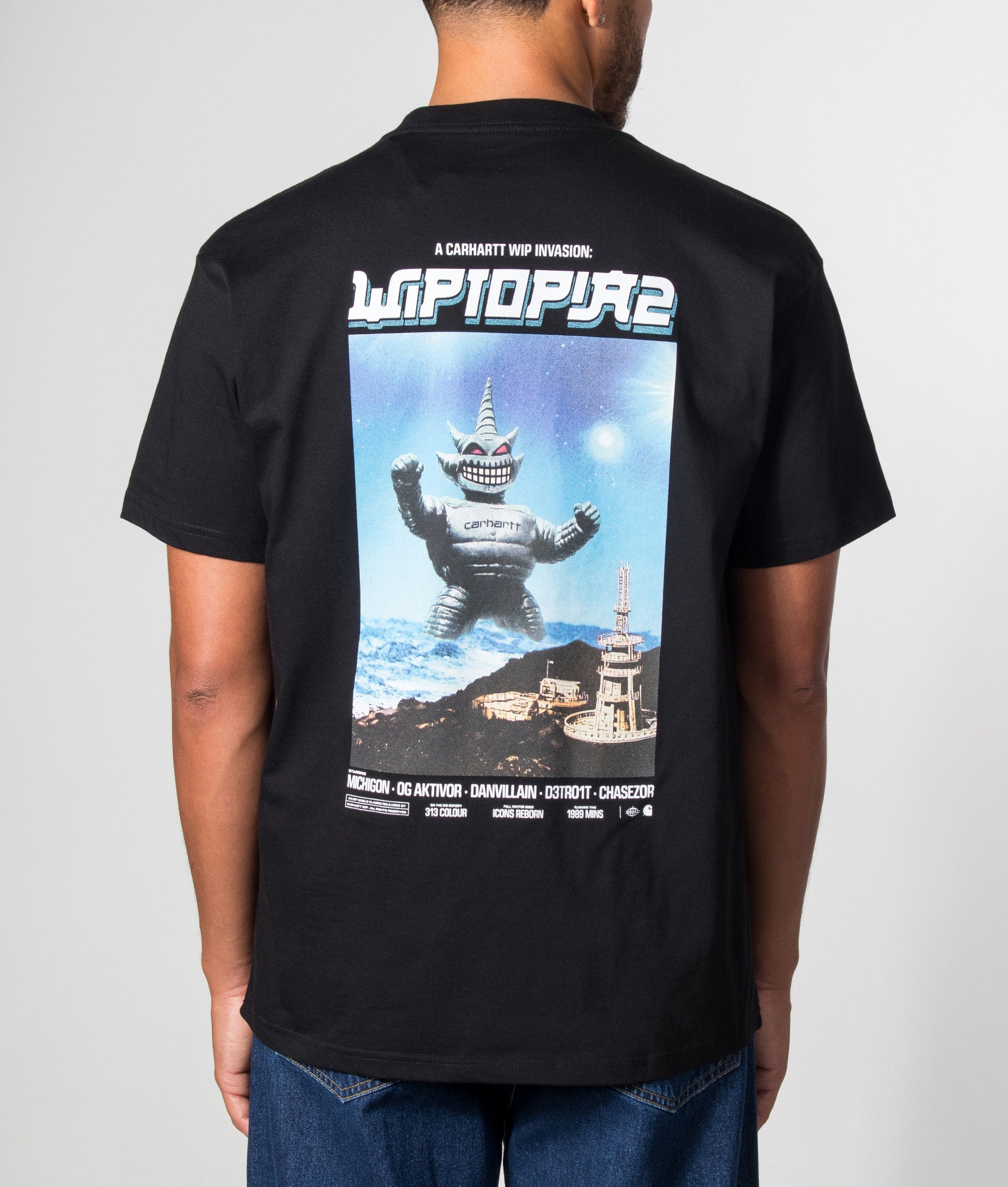Carhartt WIP Loose Fit Wiptopia II T-Shirt in Black at EQVVS Menswear. Model back shot.