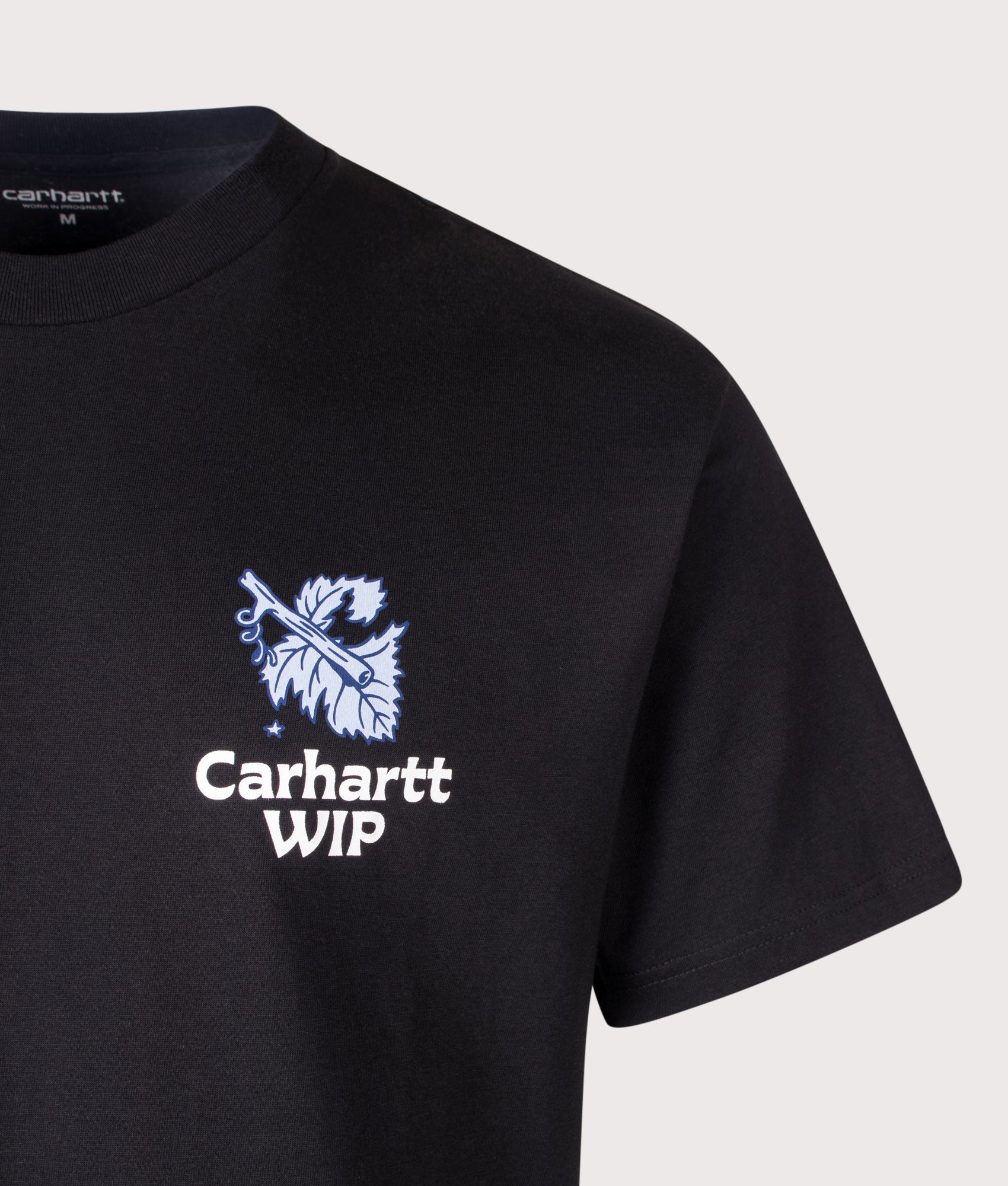 Carhartt WIP Loose Fit Grape Picker T-Shirt in Black at EQVVS Menswear. Detail shot.