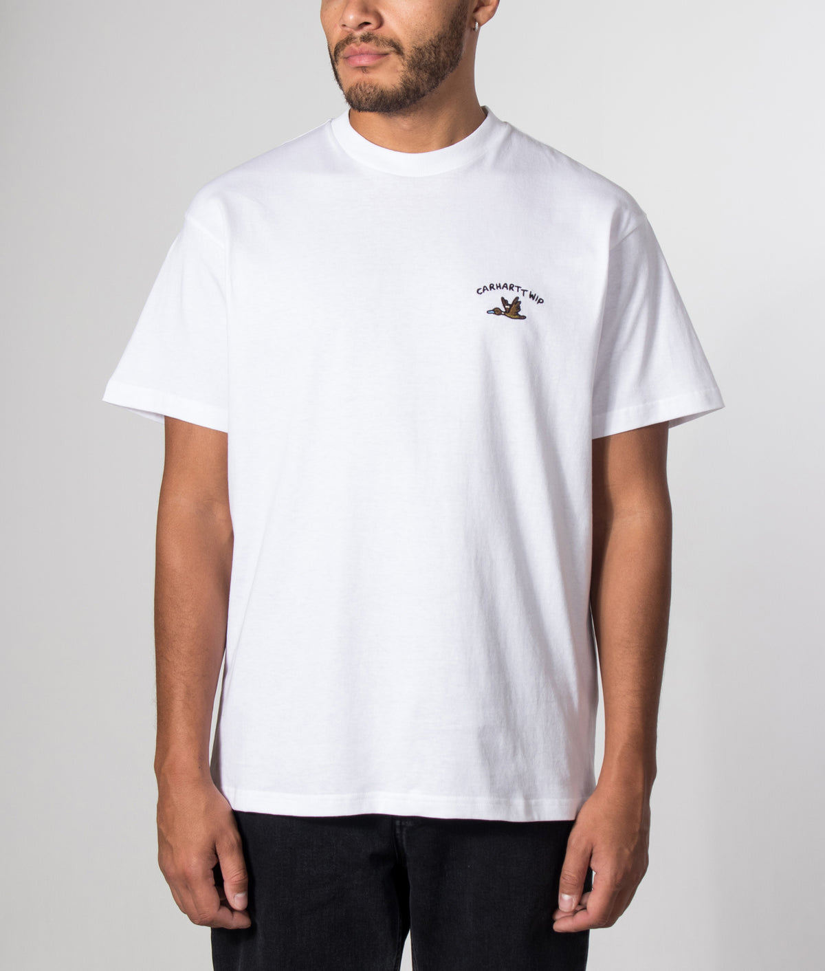 Carhartt WIP Loose Fit Animated Ducks T-Shirt in White at EQVVS Menswear. Model front shot.