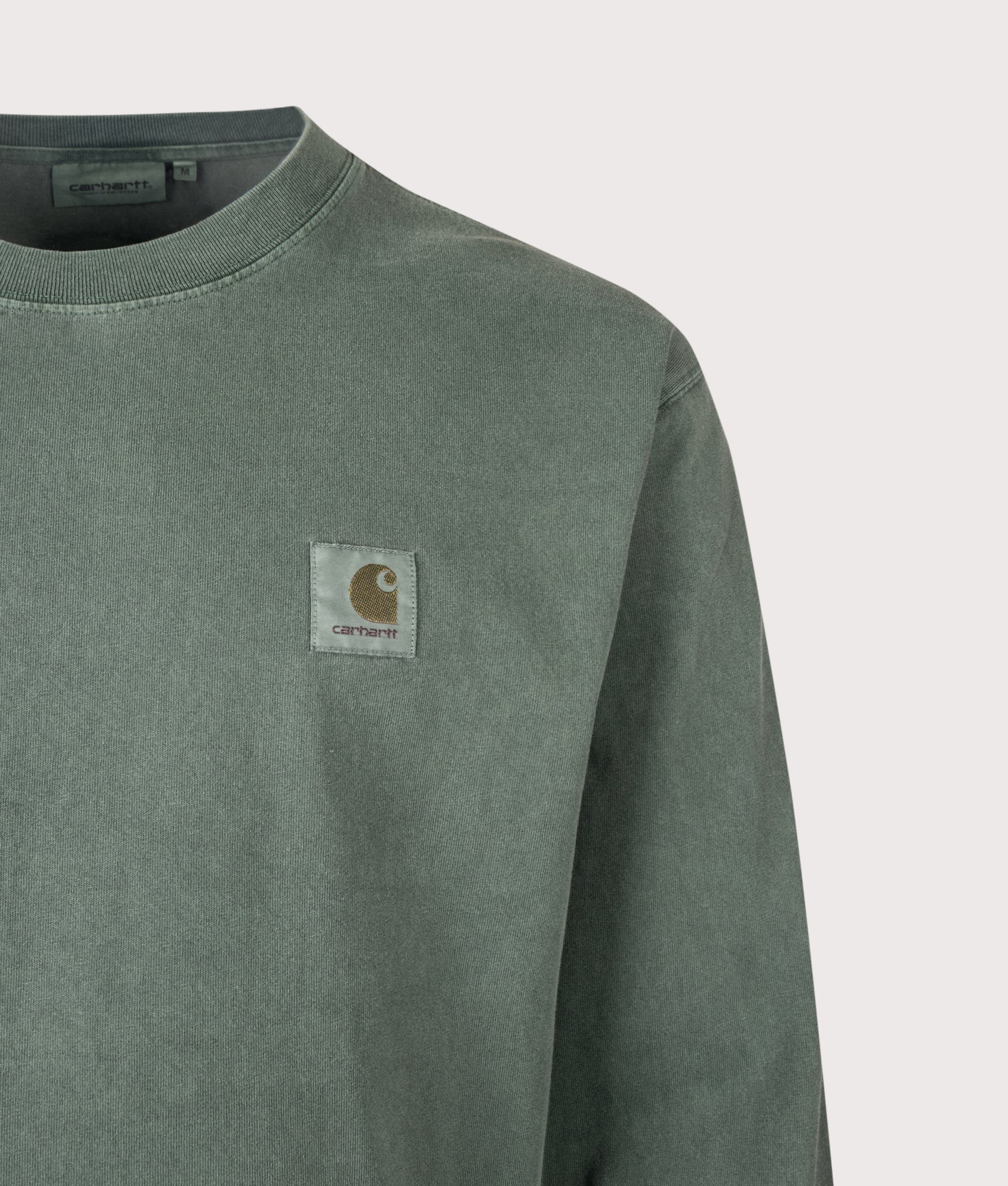 Carhartt WIP Loose Fit Vista Long Sleeve T-Shirt in Dark Scarab at EQVVS Menswear. Detail shot.