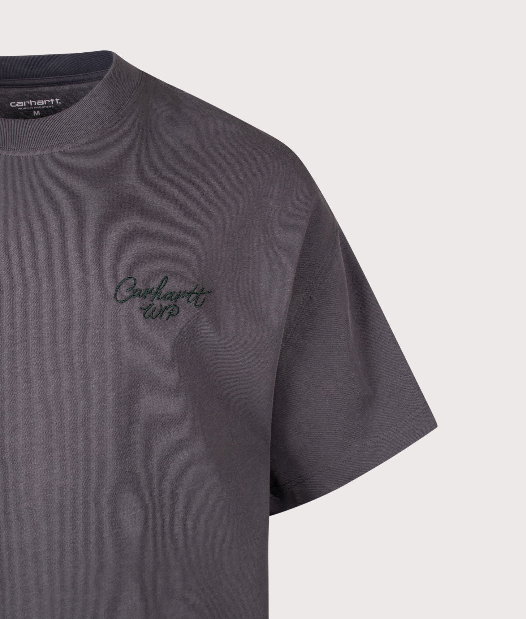 Carhartt WIP Boxy Loose Fit Signature Script T-Shirt in Graphite and Dark Scarab at EQVVS Menswear. Detail shot.