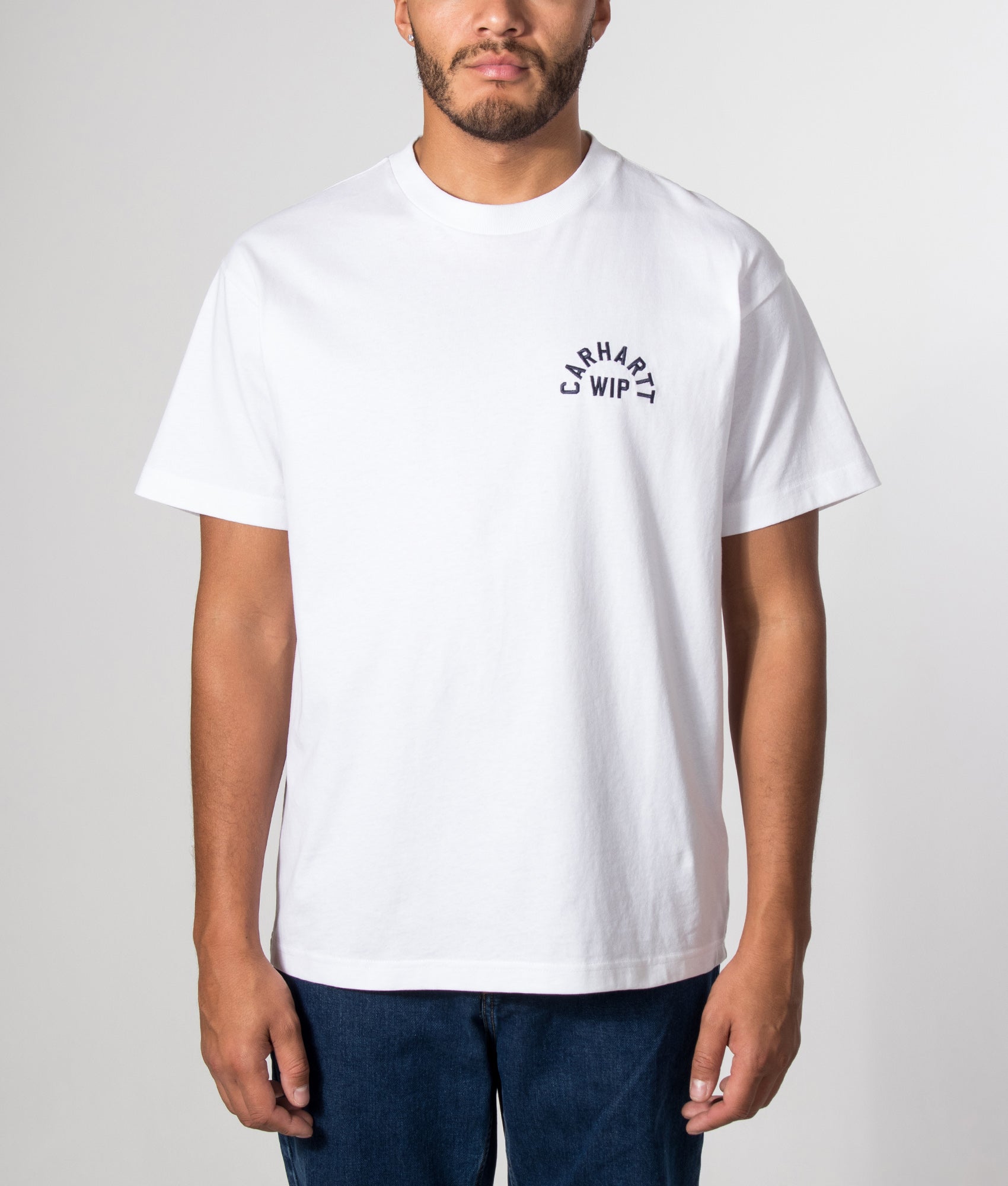 Carhartt WIP Loose Fit Arch Script T-Shirt in White and Dark Navy at EQVVS Menswear. Model front shot.