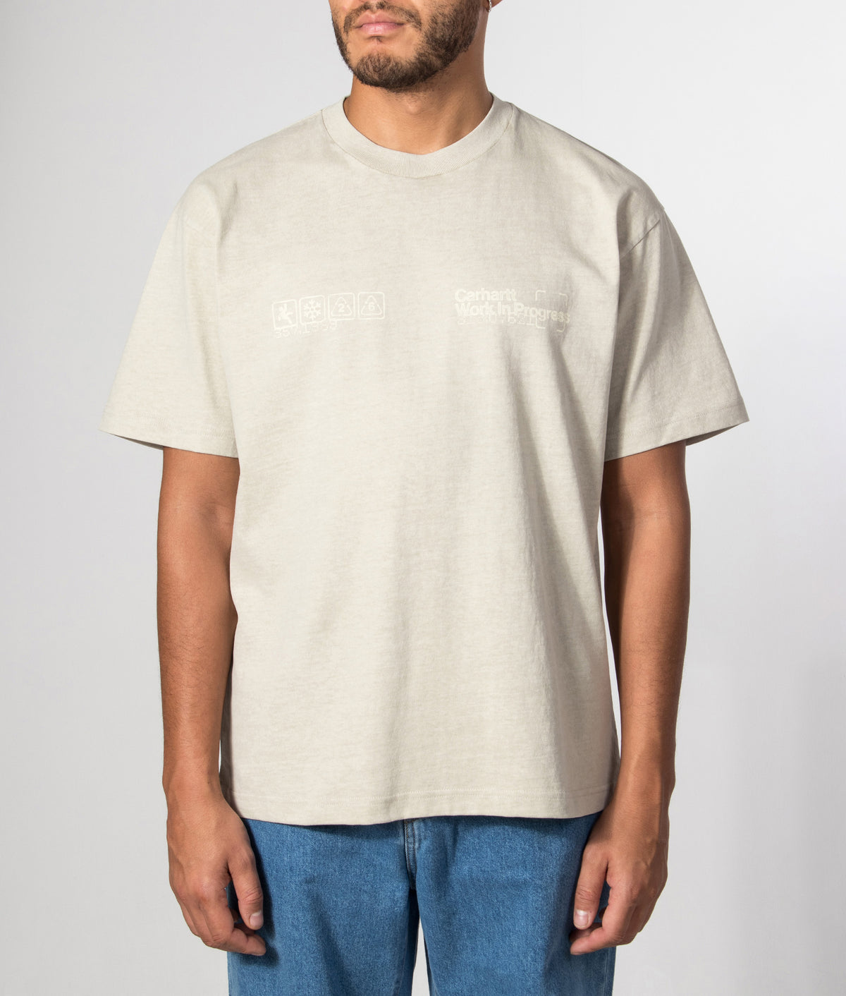 Carhartt WIP Loose Fit Boxed T-Shirt in Fleur De Sel at EQVVS Menswear. Model front shot.