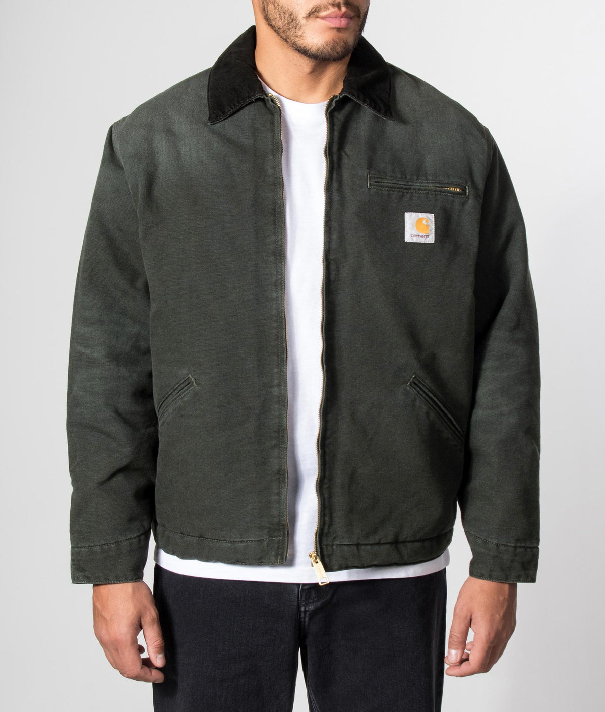 Carhartt WIP Loose Fit OG Detroit Jacket in Raven and Black at EQVVS Menswear. Model front shot.