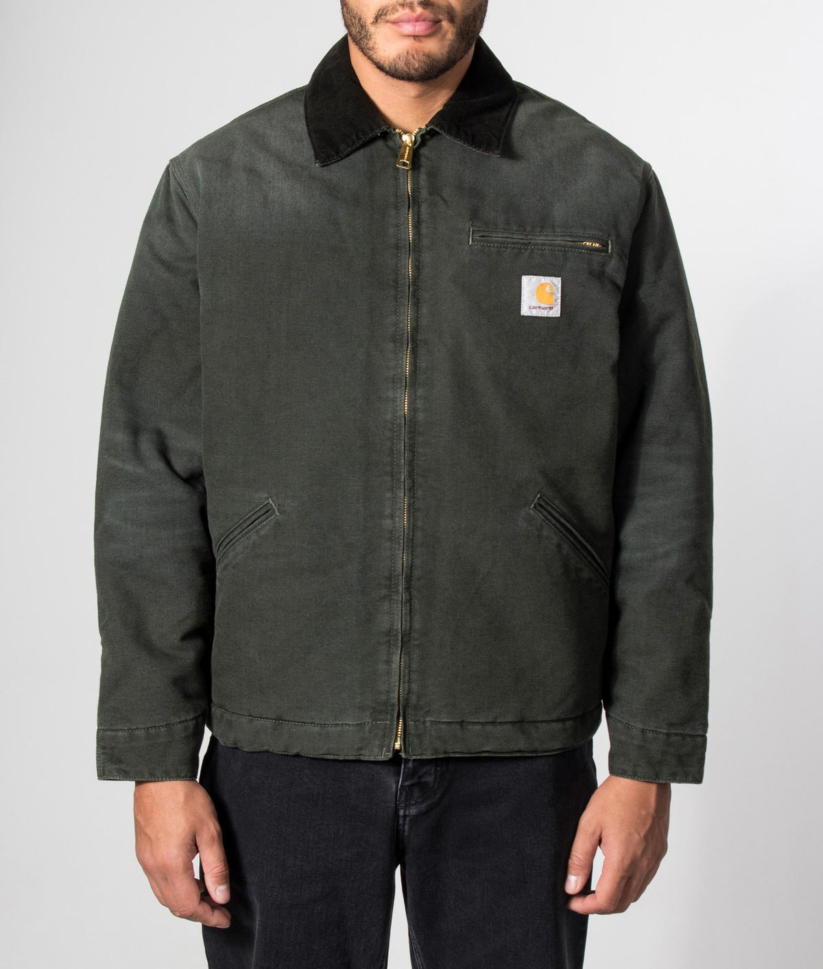 Carhartt WIP Loose Fit OG Detroit Jacket in Raven and Black at EQVVS Menswear. Model front shot.