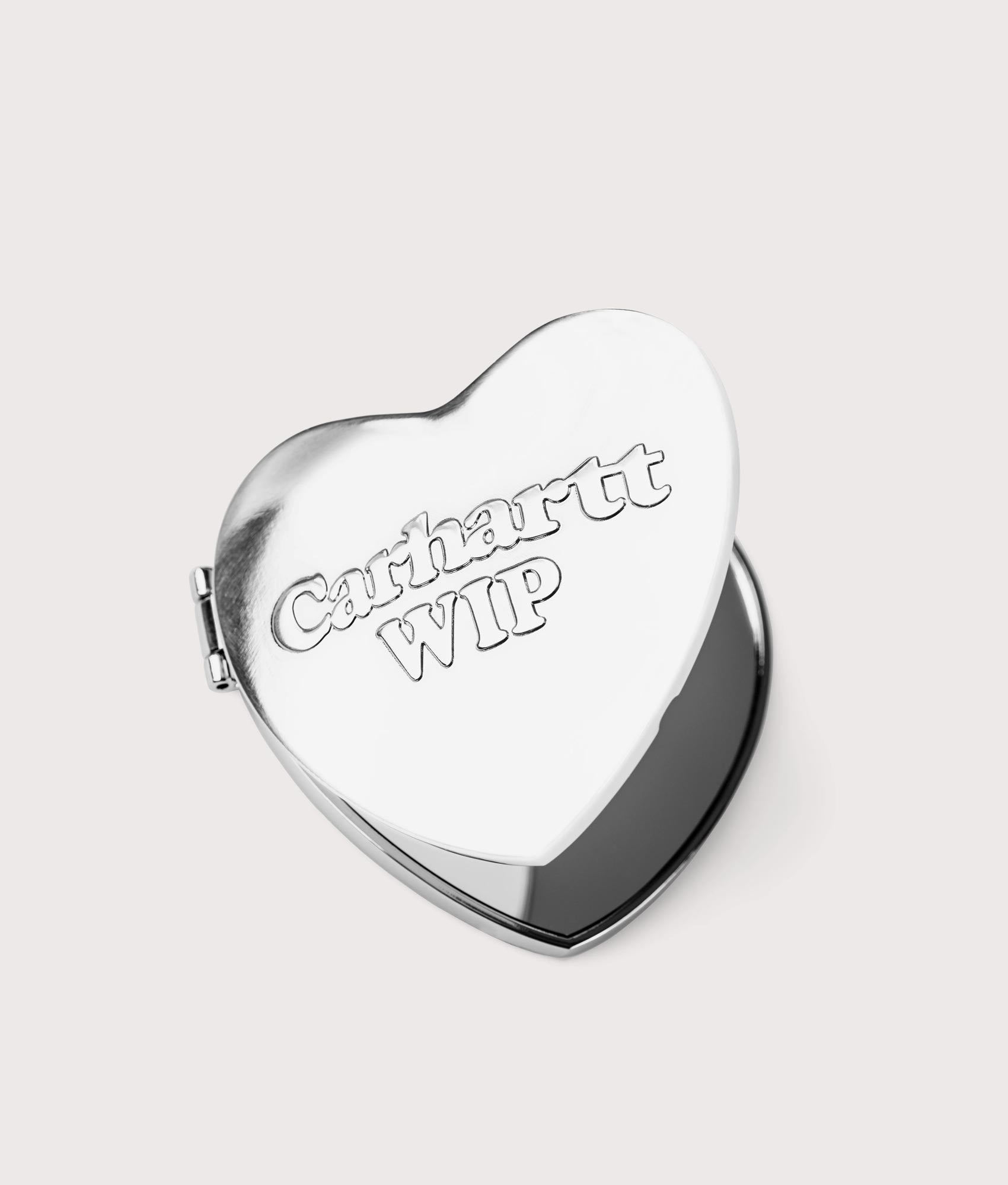 Carhartt WIP Heart Pocket Mirror in Silver at EQVVS Menswear. Front shot.