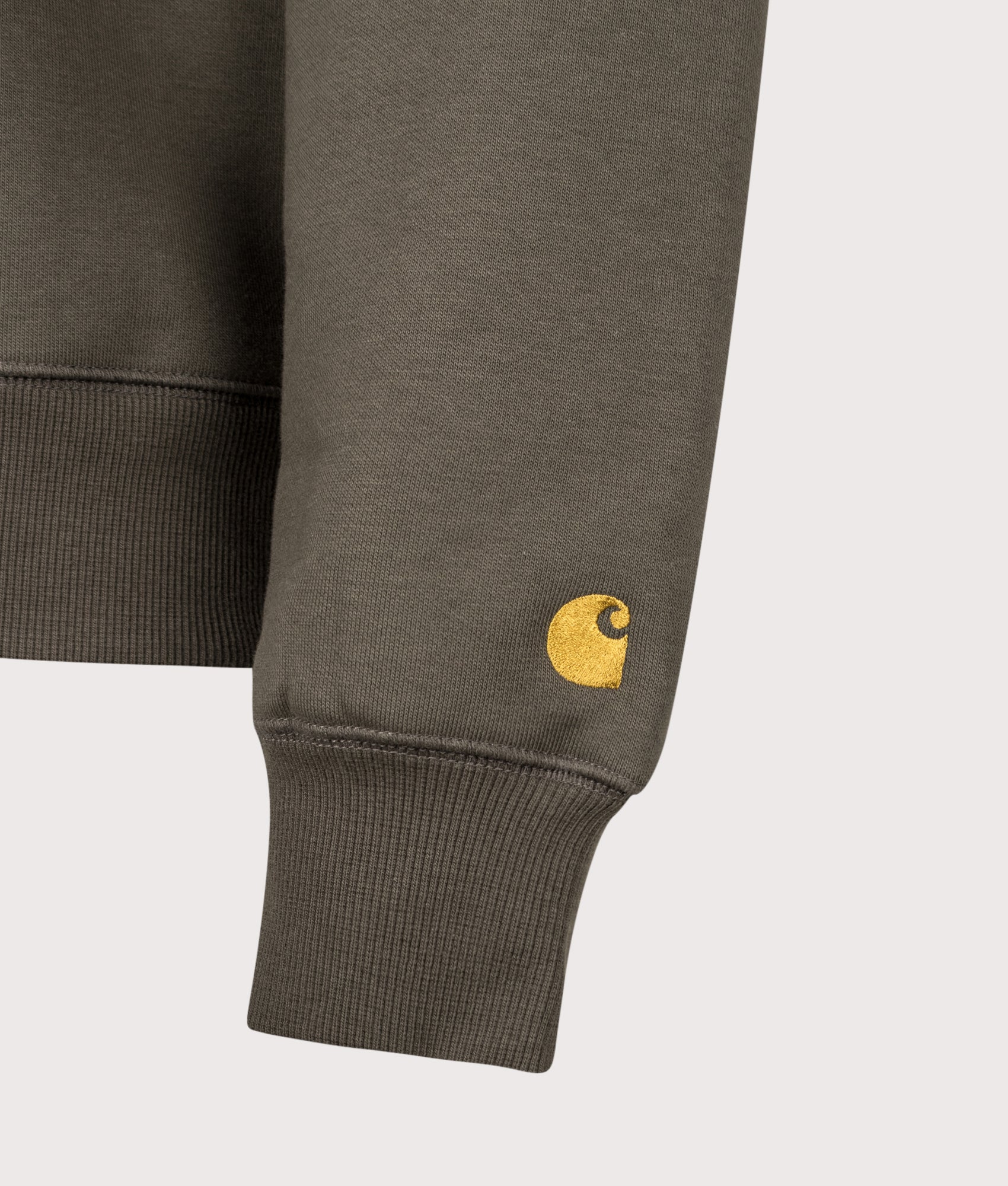 Carhartt WIP Regular Fit Chase Sweatshirt in Shungite and Gold at EQVVS Menswear. Detail shot.