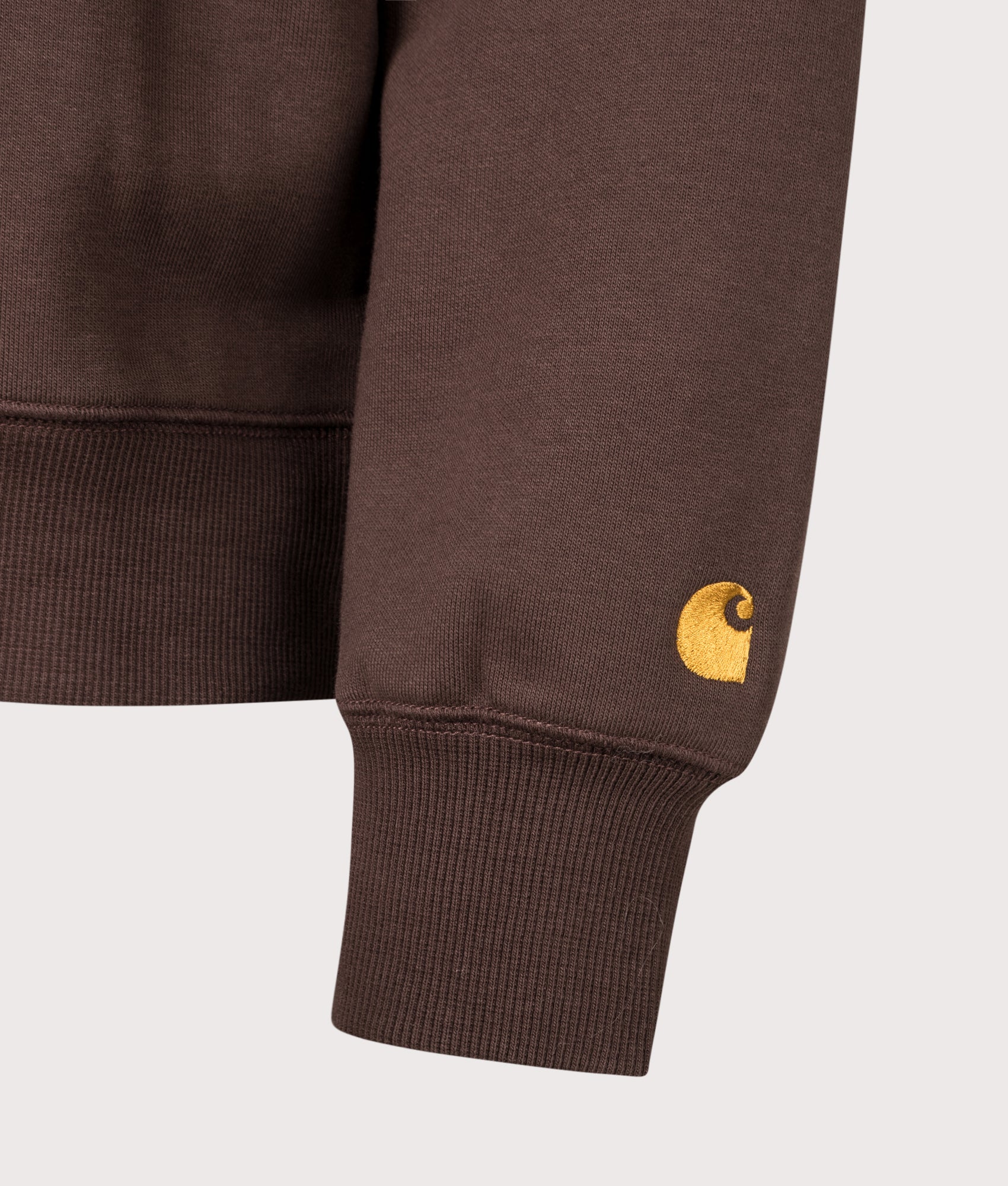 Carhartt WIP Regular Fit Chase Sweatshirt in Palisander and Gold at EQVVS Menswear. Detail shot.