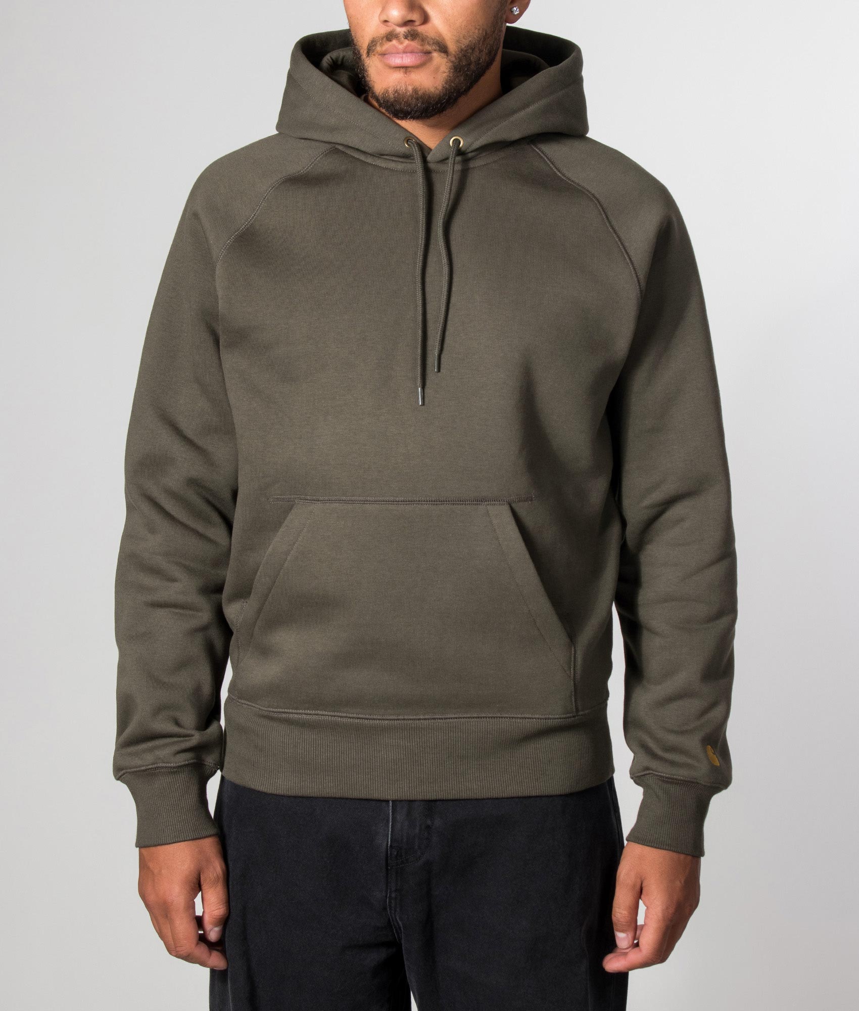 Carhartt WIP Regular Fit Chase Hoodie in Shungite and Gold at EQVVS Menswear. Model front shot.