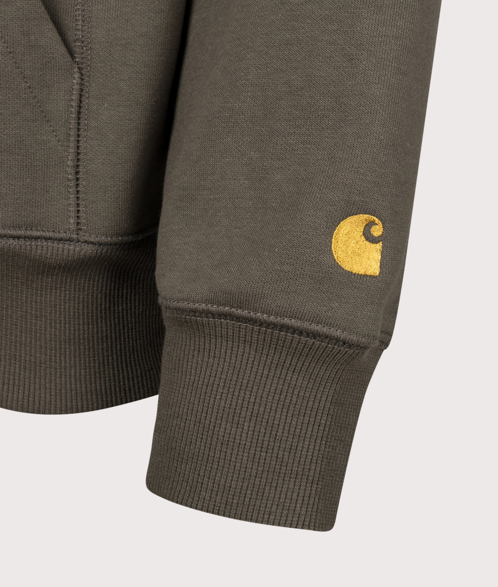 Carhartt WIP Regular Fit Chase Hoodie in Shungite and Gold at EQVVS Menswear. Detail shot.