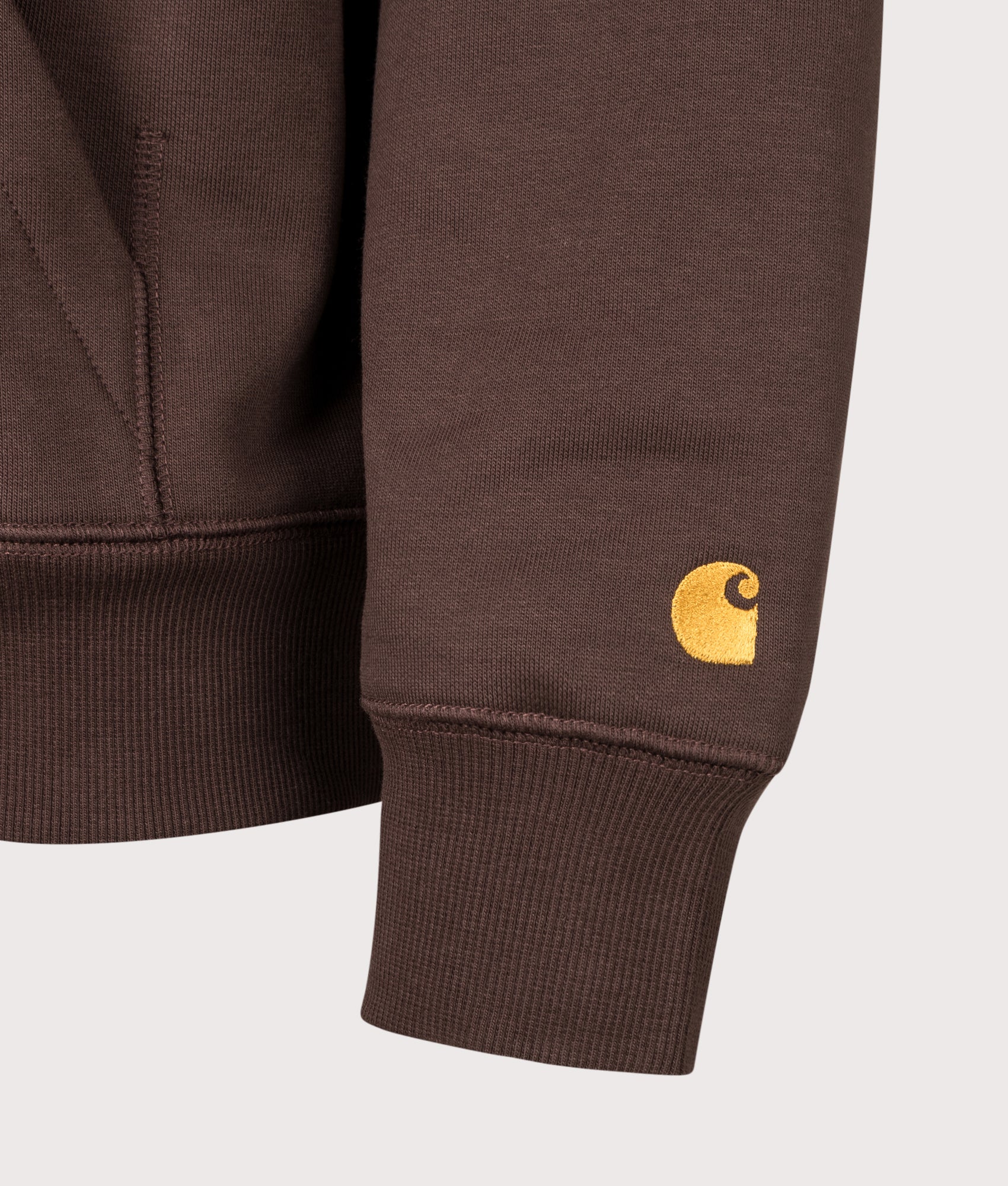 Carhartt WIP Regular Fit Chase Hoodie arrives in Palisander and Gold at EQVVS Menswear. Detail shot.