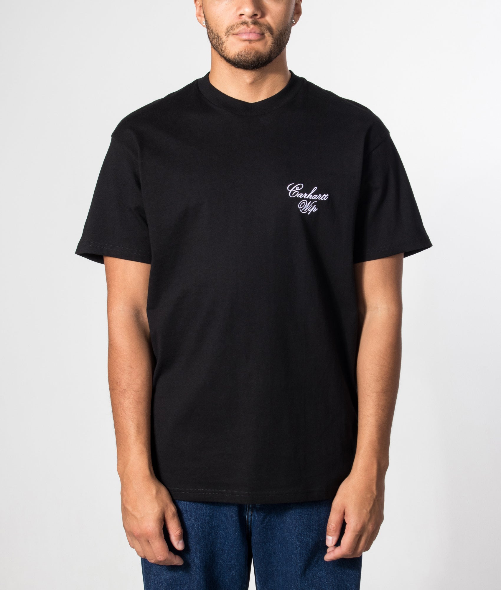 Carhartt WIP Loose Fit Gracious T-Shirt in Black at EQVVS Menswear. Model front shot.