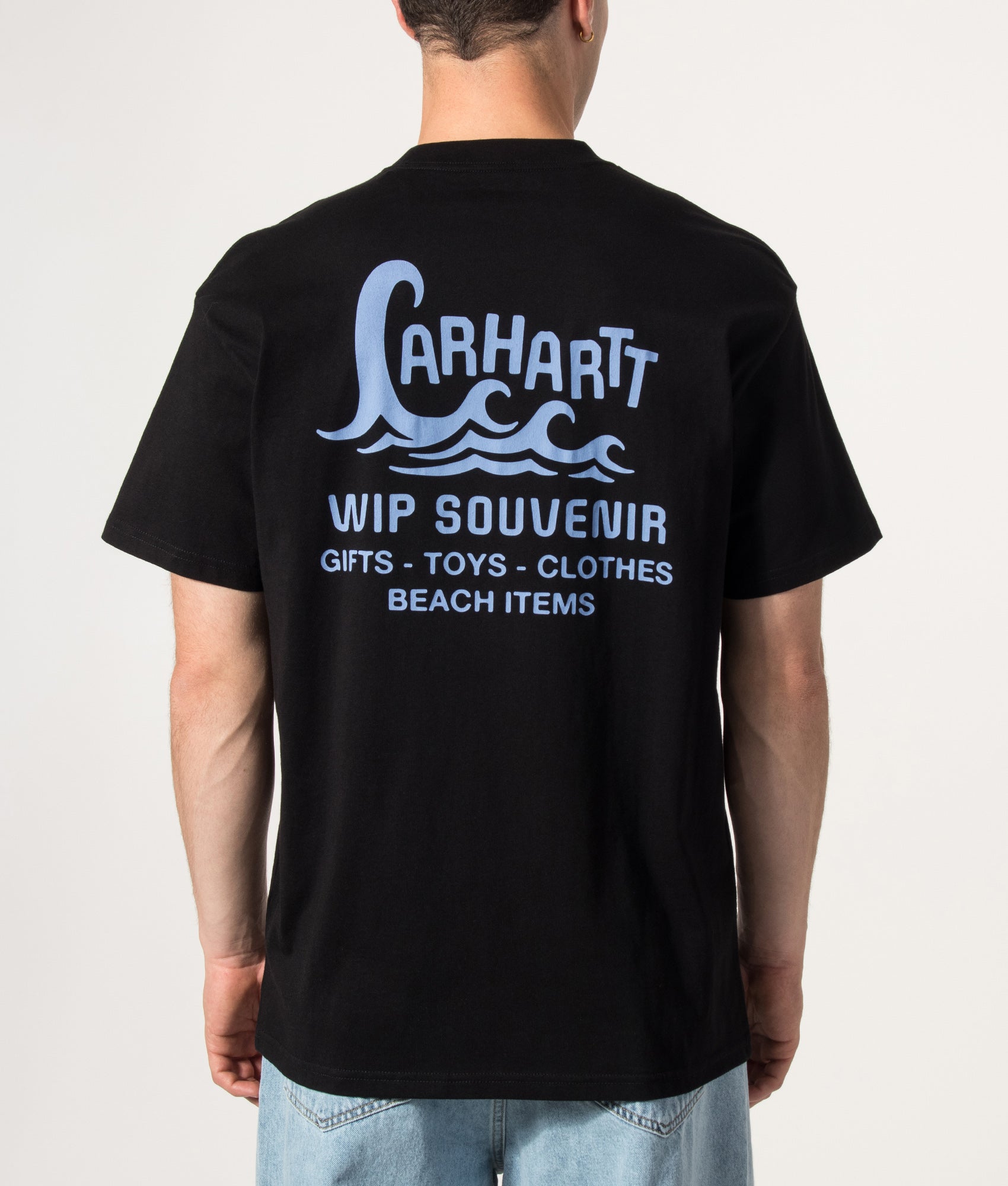 Carhartt WIP Loose Fit Waves T-Shirt in Black at EQVVS Menswear. Model back shot.