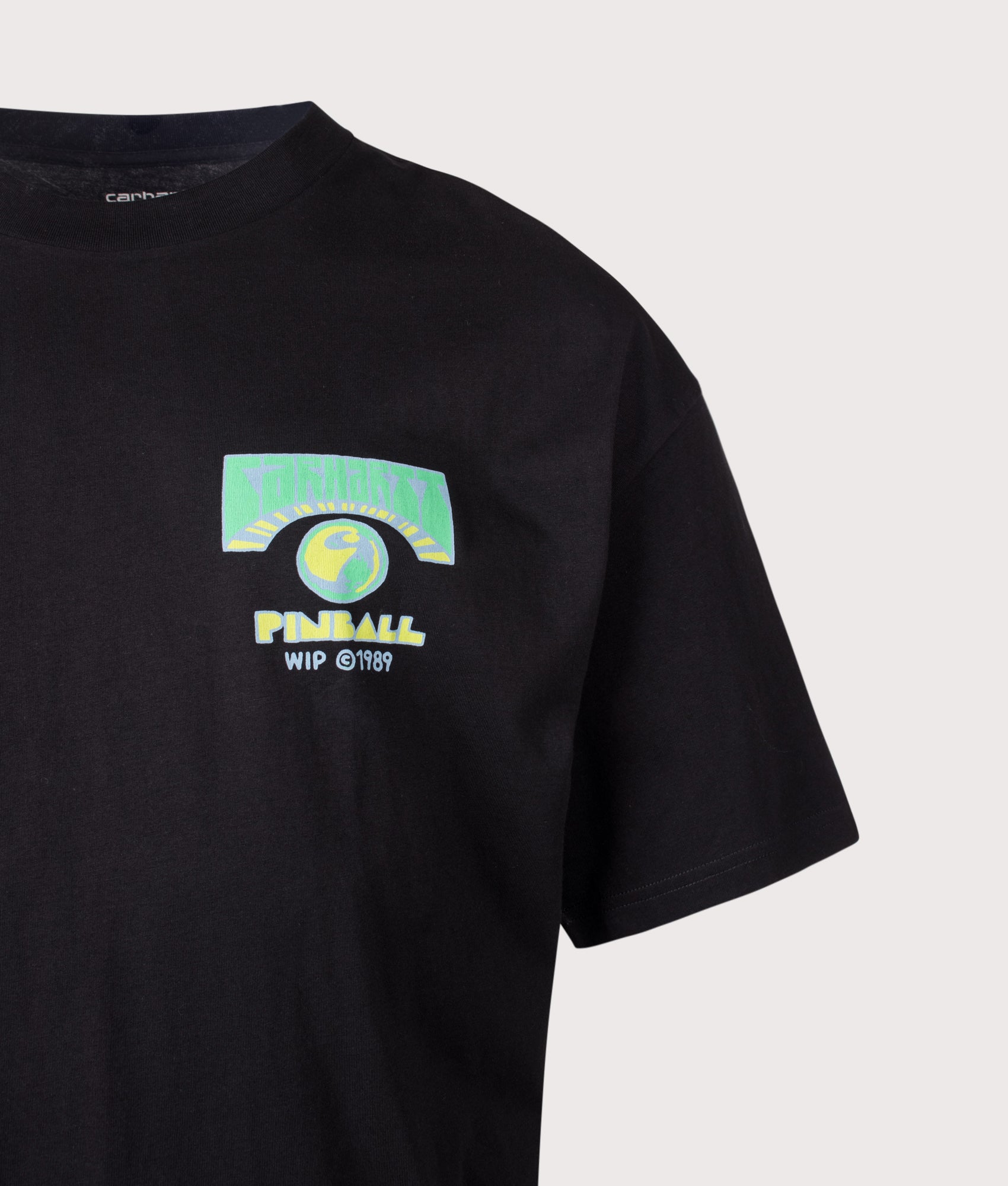 Carhartt WIP Oversized Fit Pinball T-Shirt in Black at EQVVS Menswear. Detail shot.
