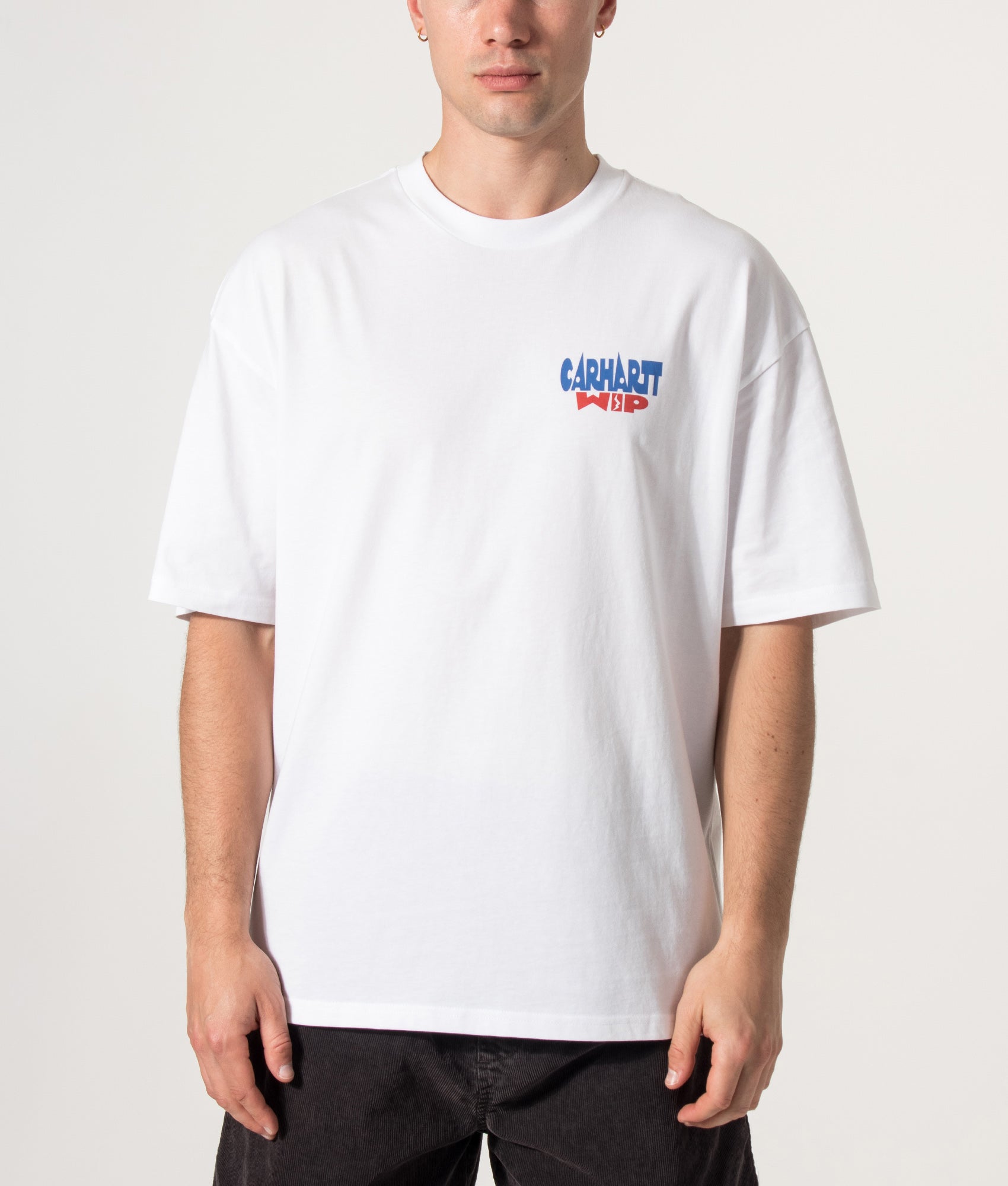 Carhartt WIP Oversized Fit Luggage Label T-Shirt in White at EQVVS Menswear. Model front shot.