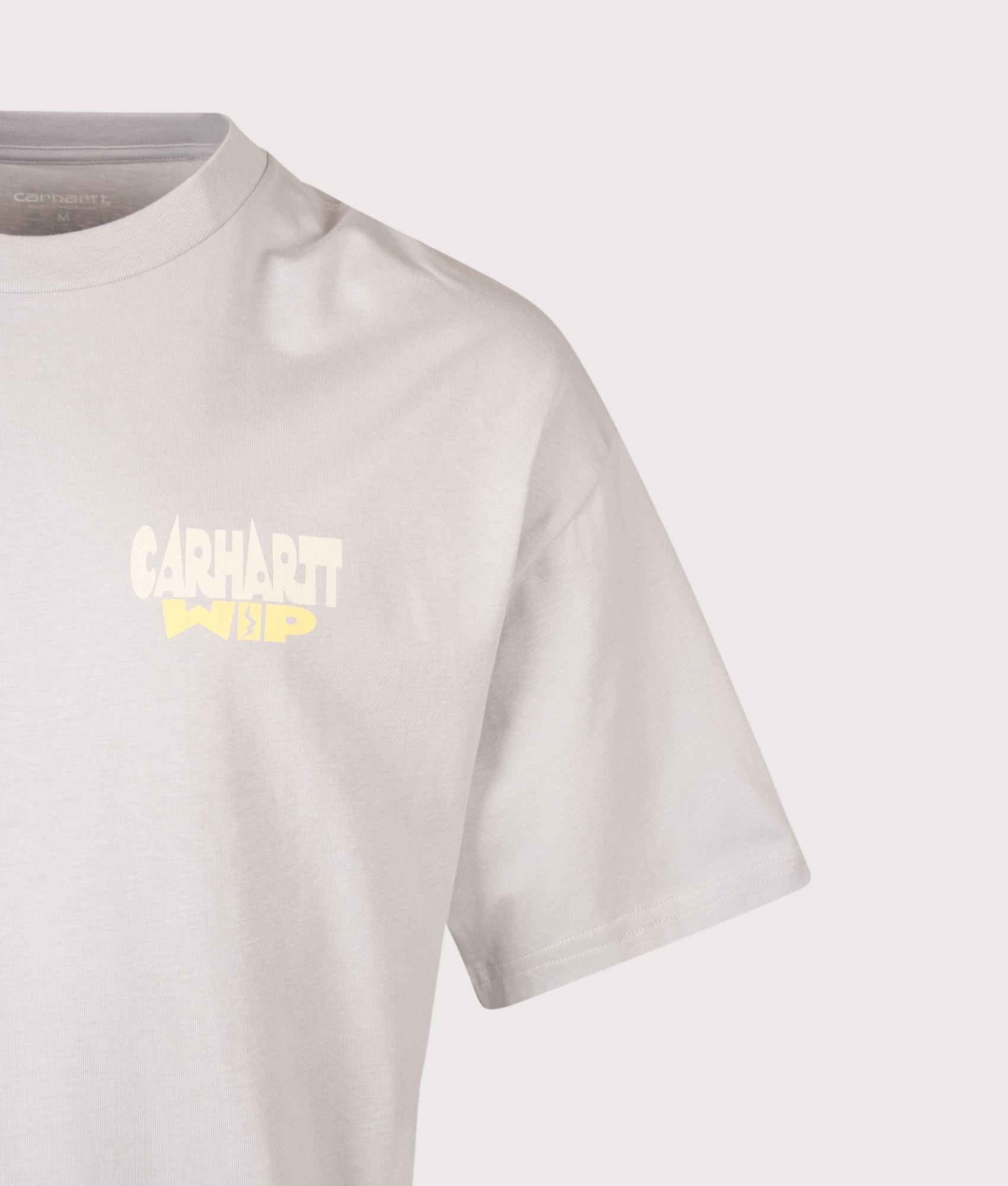 Carhartt WIP Oversized Fit Luggage Label T-Shirt in Pontiki at EQVVS Menswear. Detail shot.