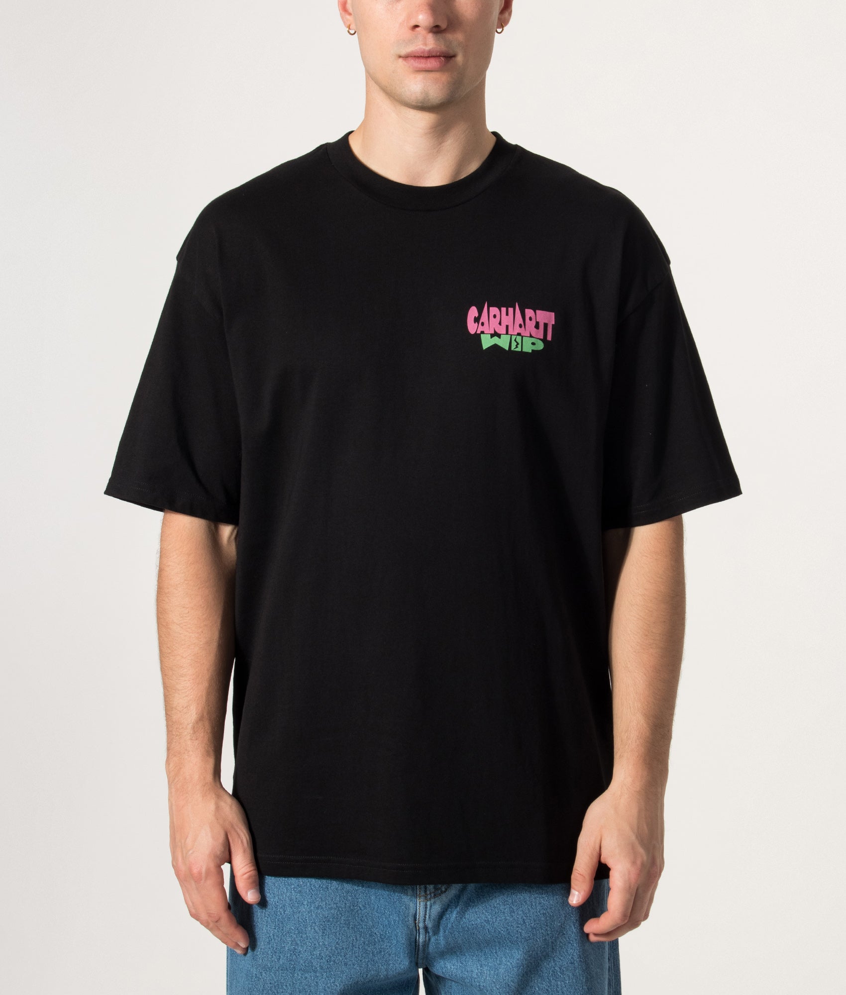 Carhartt WIP Oversized Fit Luggage Label T-Shirt in Black at EQVVS Menswear. Model front shot.