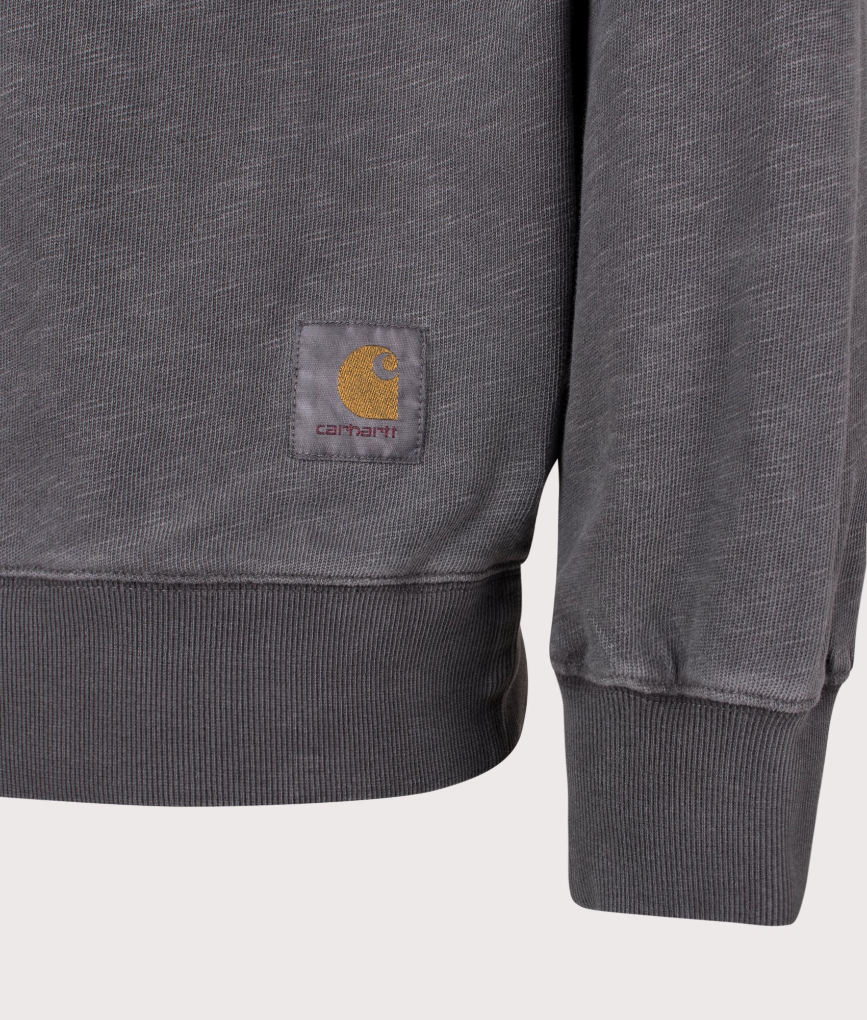 Carhartt WIP Balloon Fit Harper Quarter Zip Sweatshirt in Garment Dyed Black at EQVVS Menswear. Detail shot.