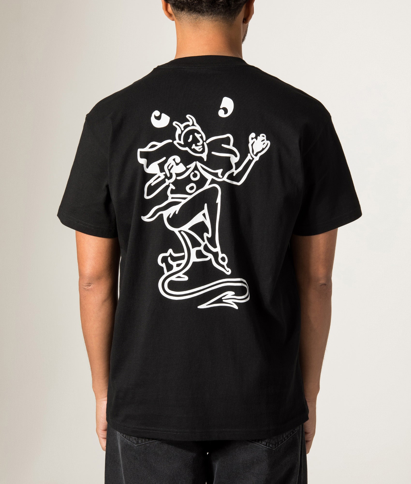Carhartt WIP Loose Fit Playing Cards T-Shirt in Black at EQVVS Menswear. Model back shot.