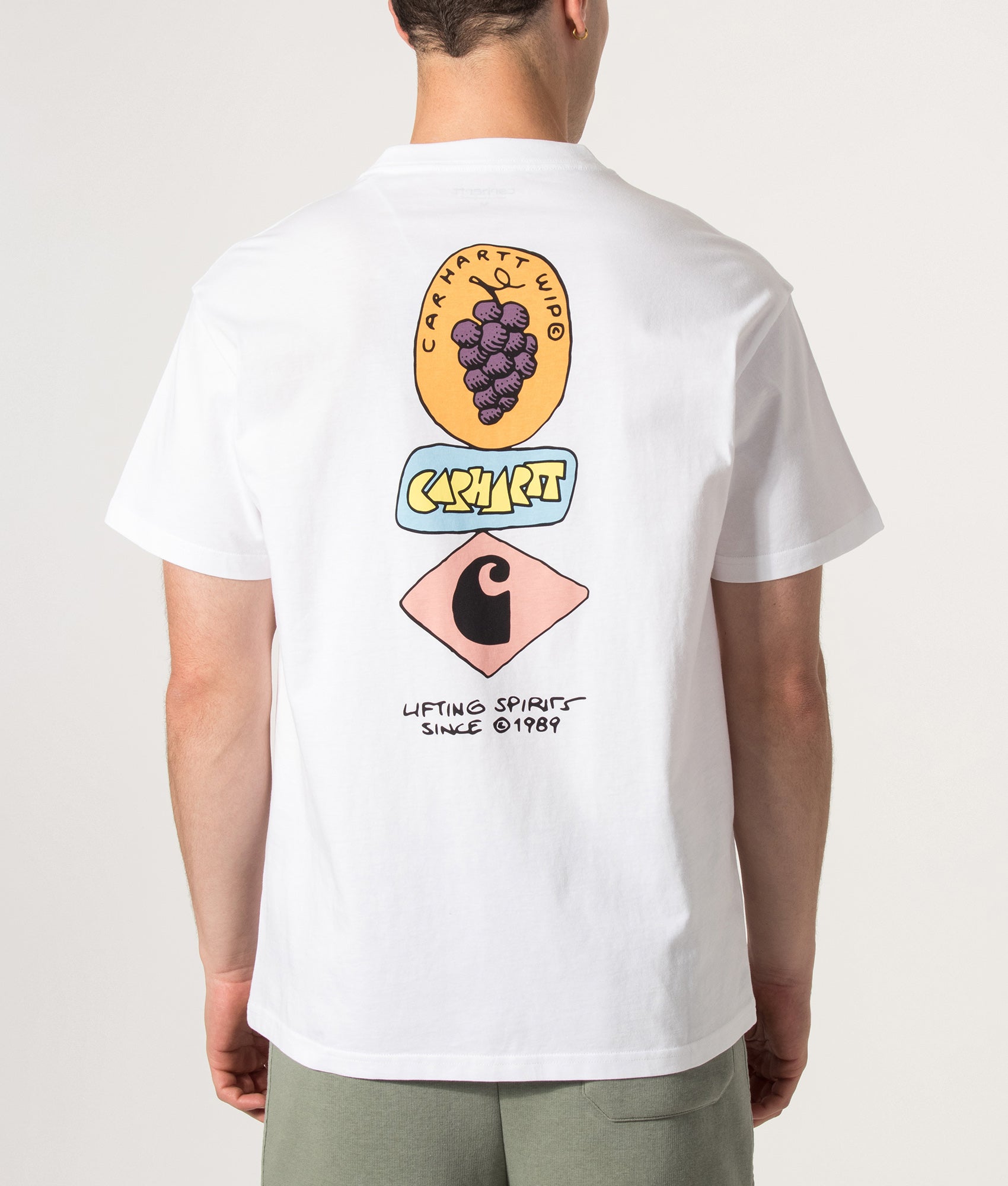 Carhartt WIP Loose Fit Stacked Grapes T-Shirt in White at EQVVS Menswear. Model back shot.