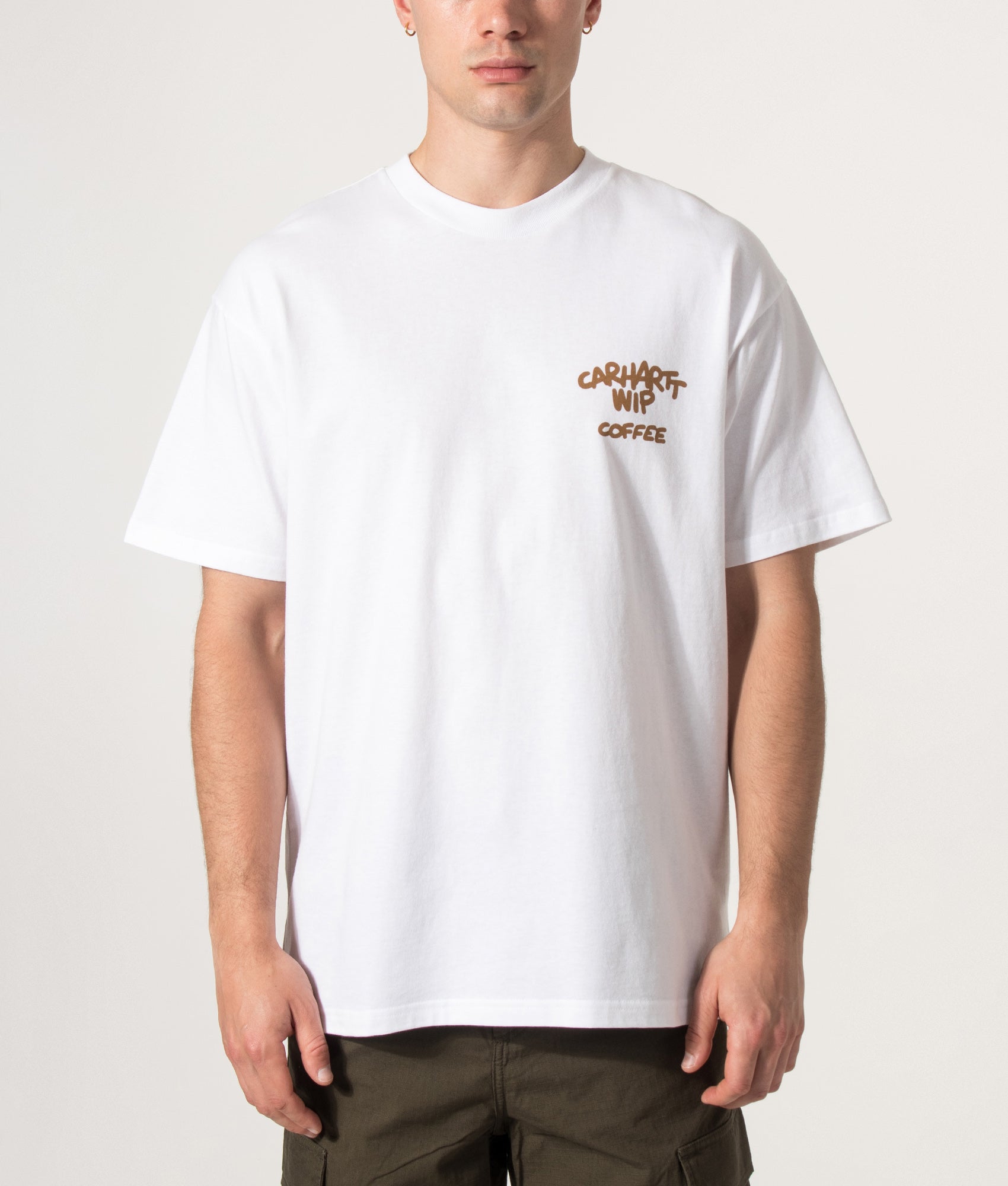 Carhartt WIP Loose Fit Coffee Break T-Shirt in White at EQVVS Menswear. Model front shot.