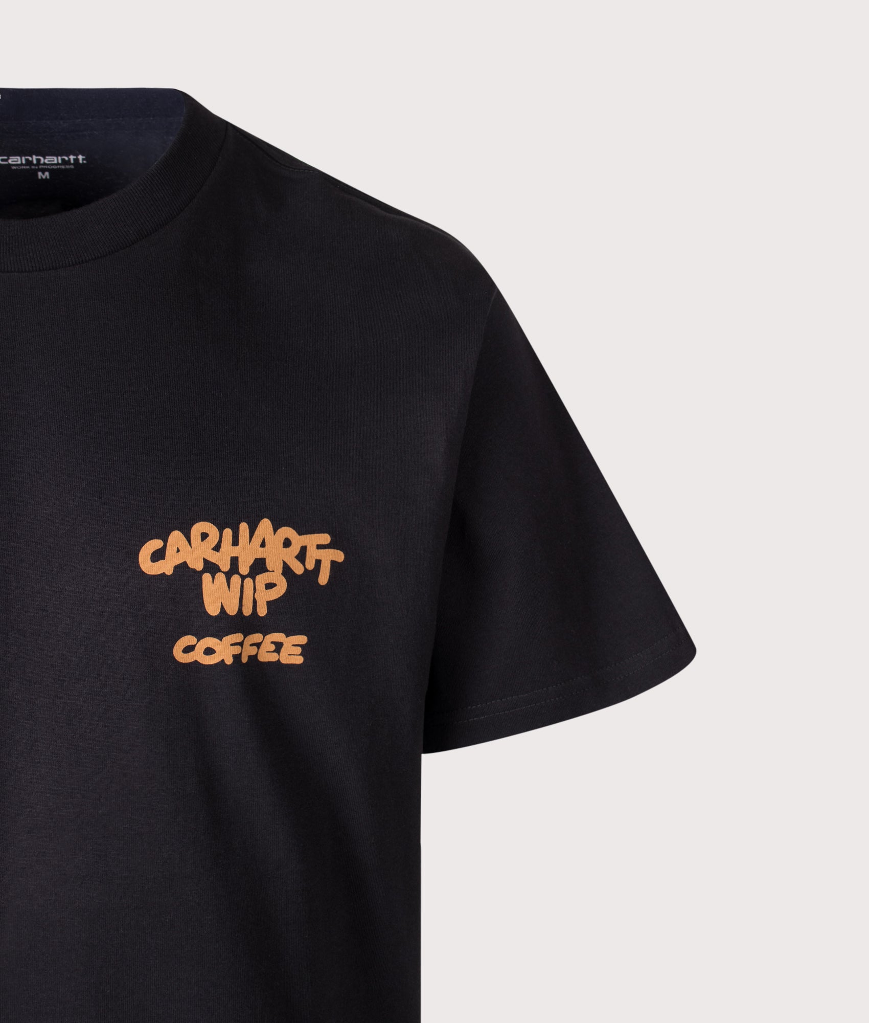 Carhartt WIP Loose Fit Coffee Break T-Shirt in Black at EQVVS Menswear. Detail shot.