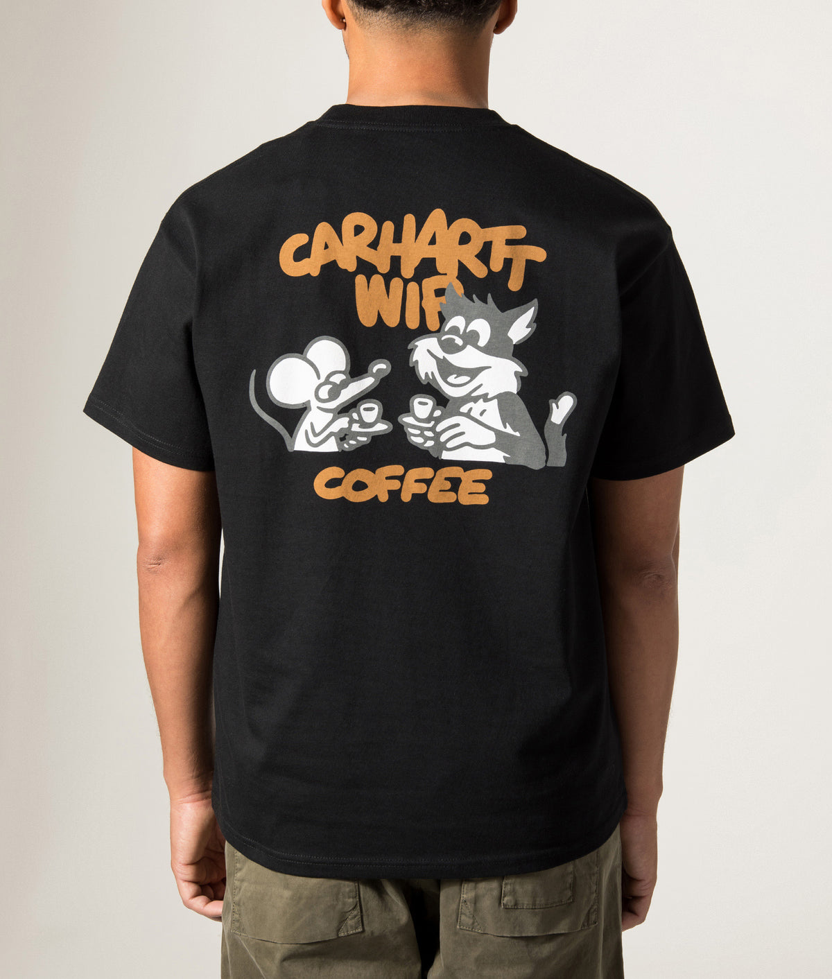Carhartt WIP Loose Fit Coffee Break T-Shirt in Black at EQVVS Menswear. Model back shot.